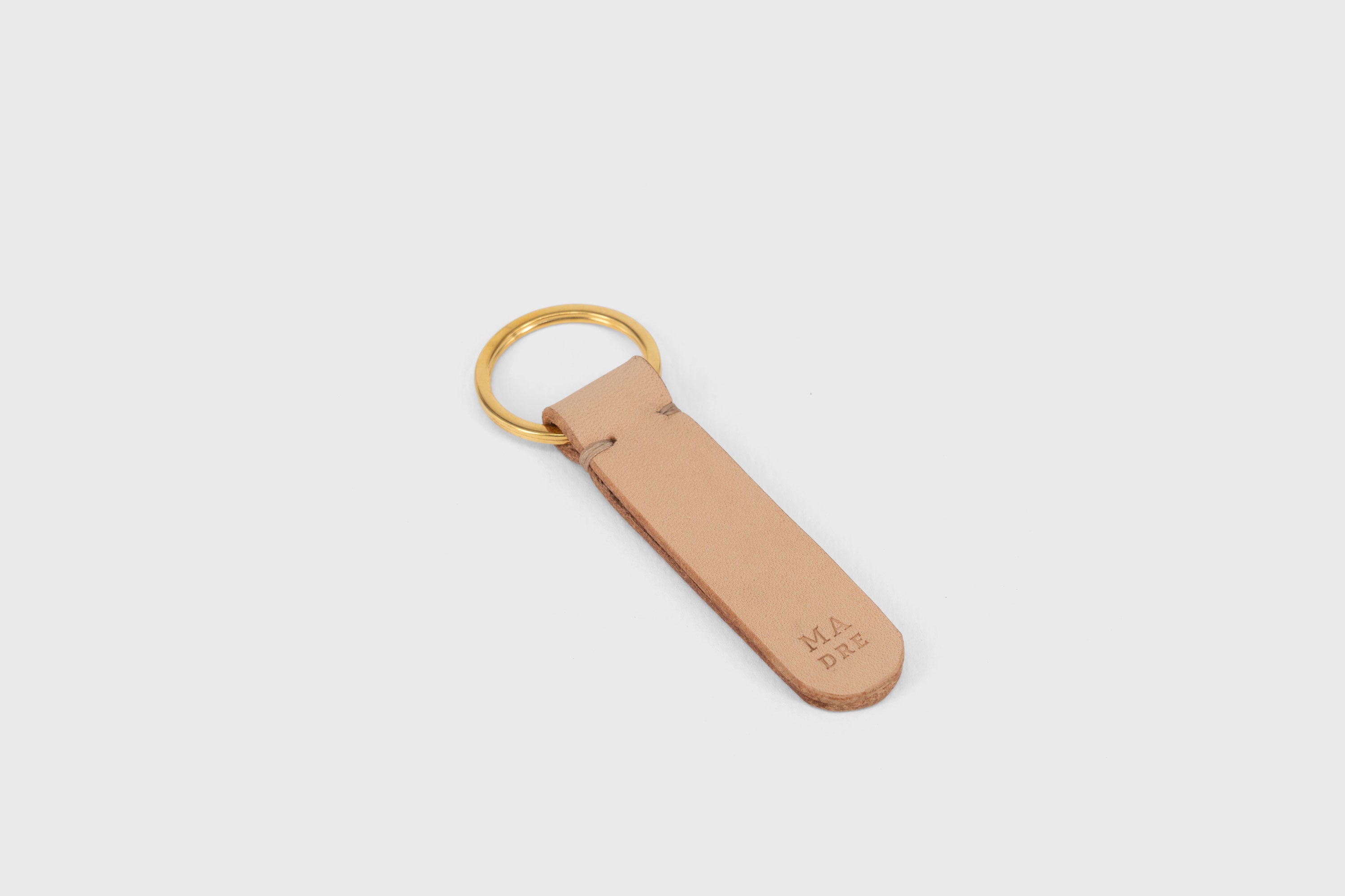 Key Ring Leather Natural Color Fob Minimalist Designer Vegetable Tanned Full Grain Handcrafted Personalised Premium Quality Gold Atelier Madre Manuel Dreesmann Barcelona Spain