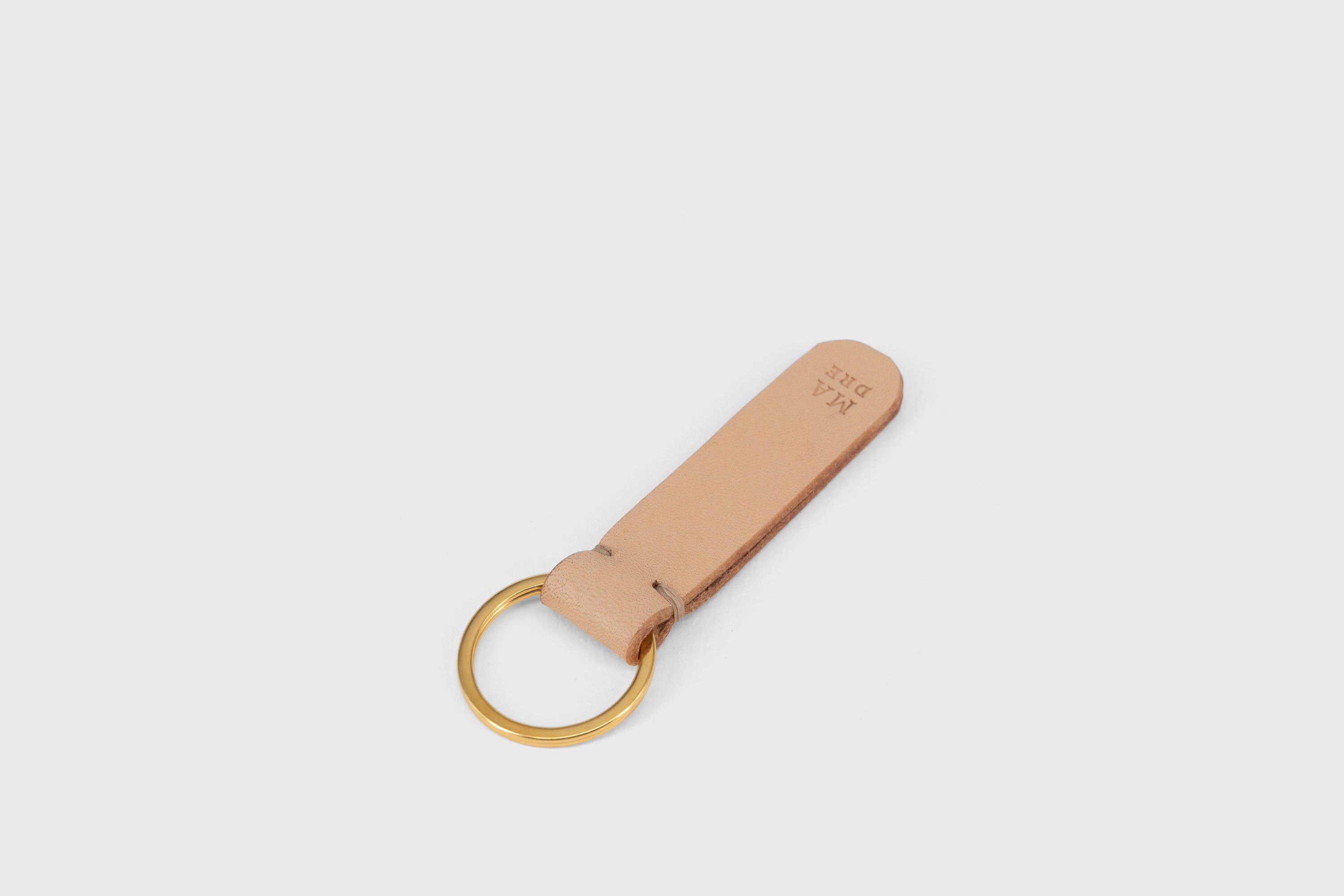Key Ring Leather Natural Color Fob Minimalist Designer Vegetable Tanned Full Grain Handcrafted Personalised Premium Quality Gold Atelier Madre Manuel Dreesmann Barcelona Spain