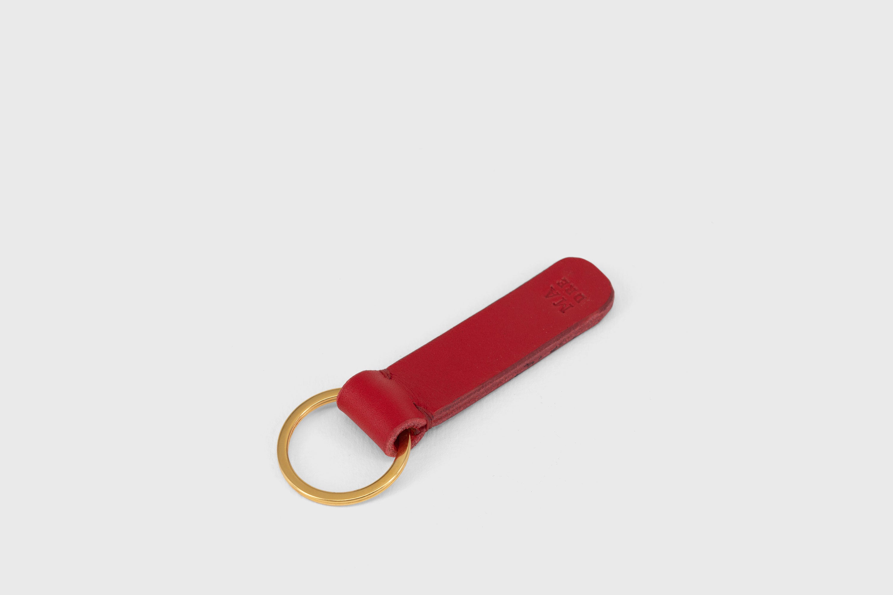 Key Ring Leather Red Color Fob Minimalist Designer Vegetable Tanned Full Grain Handcrafted Personalised Premium Quality Gold Atelier Madre Manuel Dreesmann Barcelona Spain