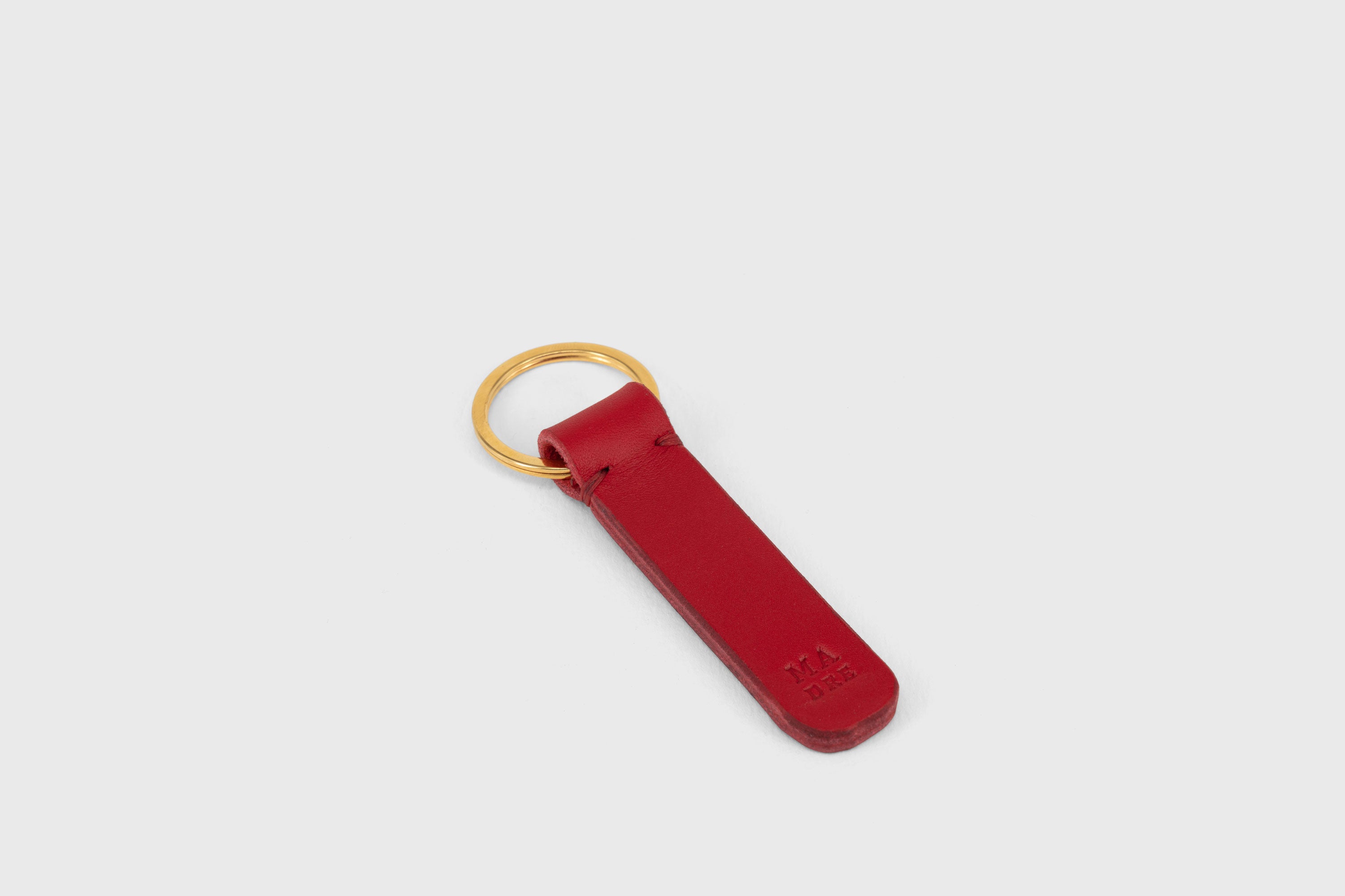 Key Ring Leather Red Color Fob Minimalist Designer Vegetable Tanned Full Grain Handcrafted Personalised Premium Quality Gold Atelier Madre Manuel Dreesmann Barcelona Spain