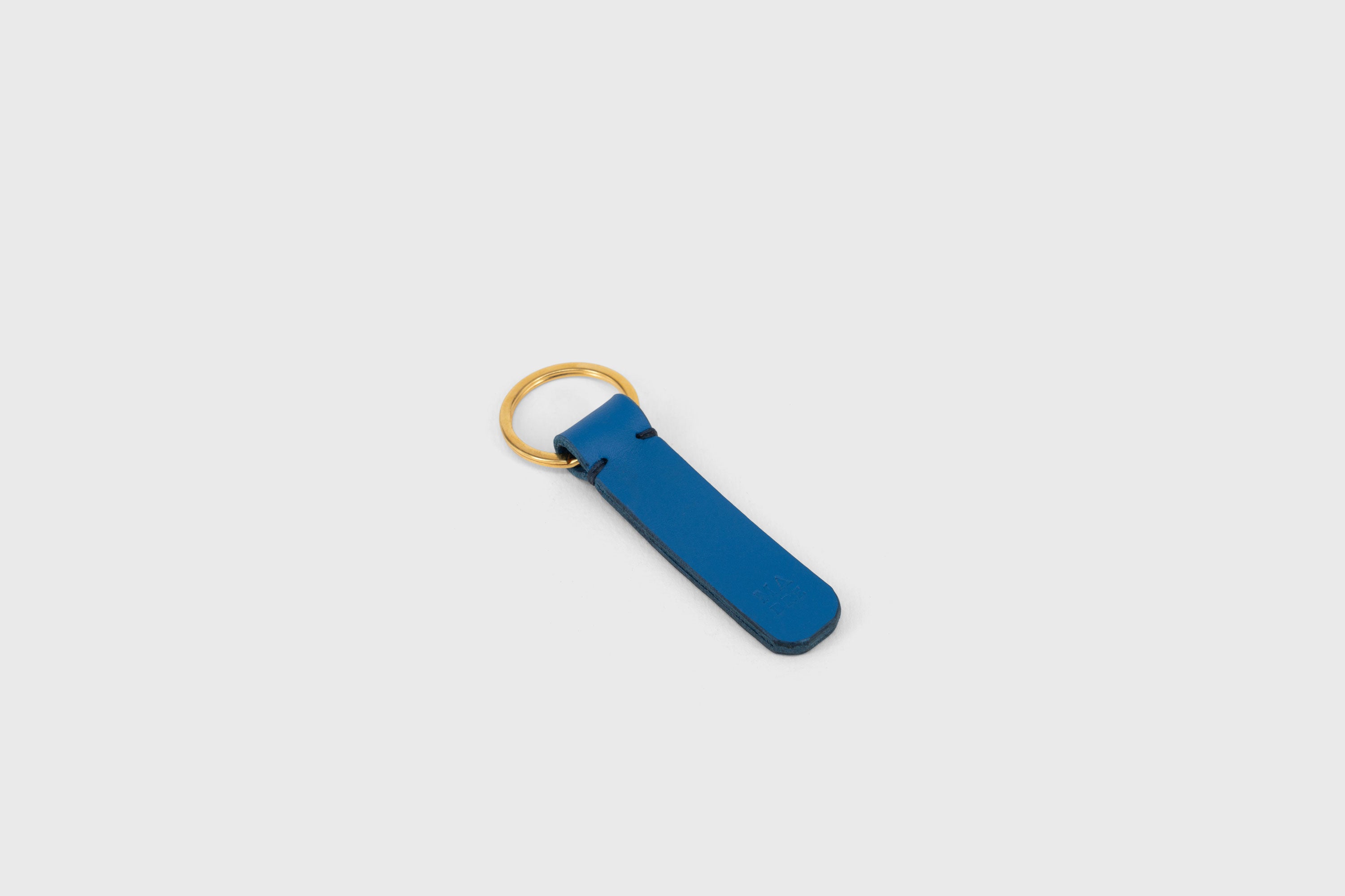 Key Ring Leather Royal Blue Color Fob Minimalist Designer Vegetable Tanned Full Grain Handcrafted Personalised Premium Quality Gold Atelier Madre Manuel Dreesmann Barcelona Spain