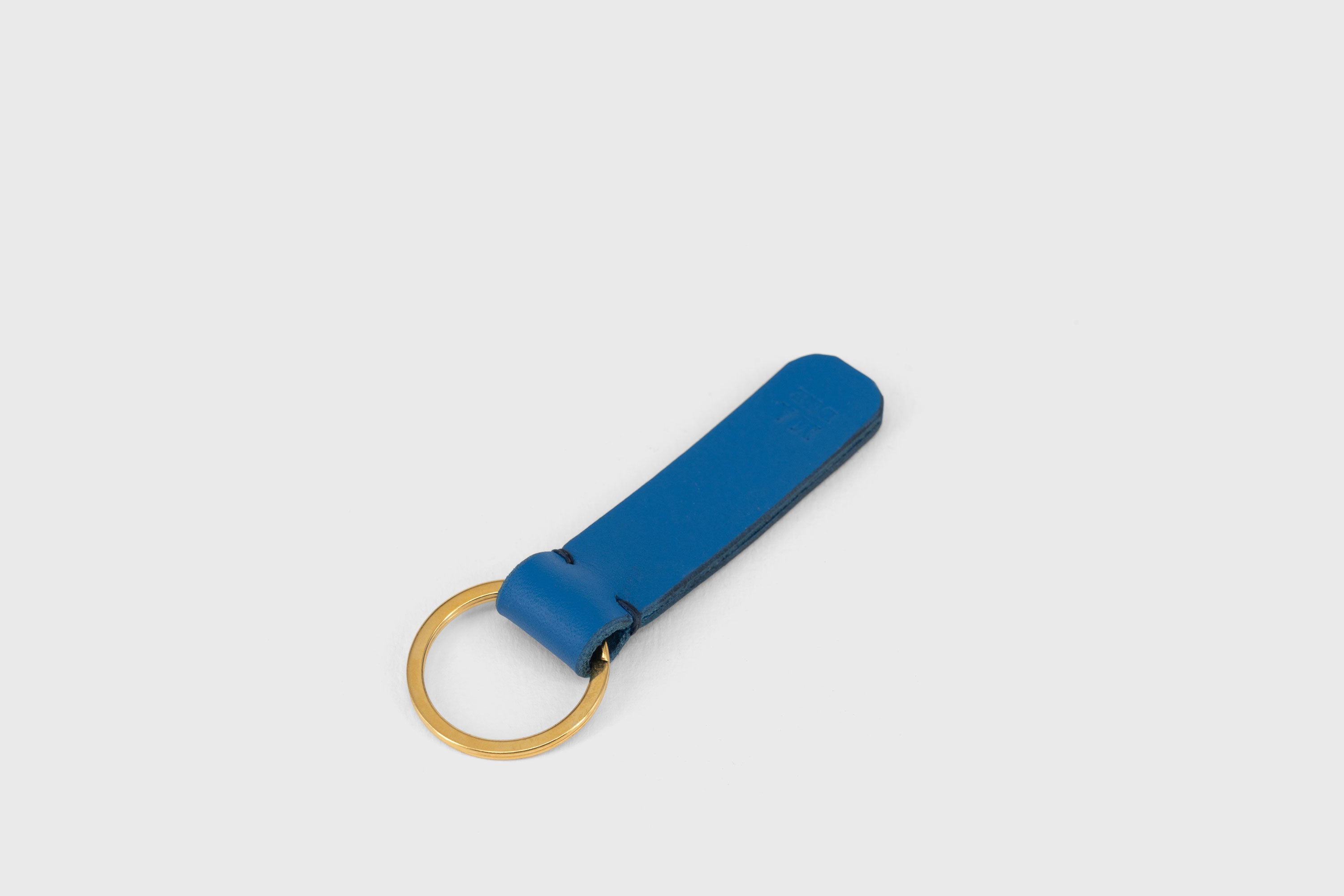 Key Ring Leather Royal Blue Color Fob Minimalist Designer Vegetable Tanned Full Grain Handcrafted Personalised Premium Quality Gold Atelier Madre Manuel Dreesmann Barcelona Spain