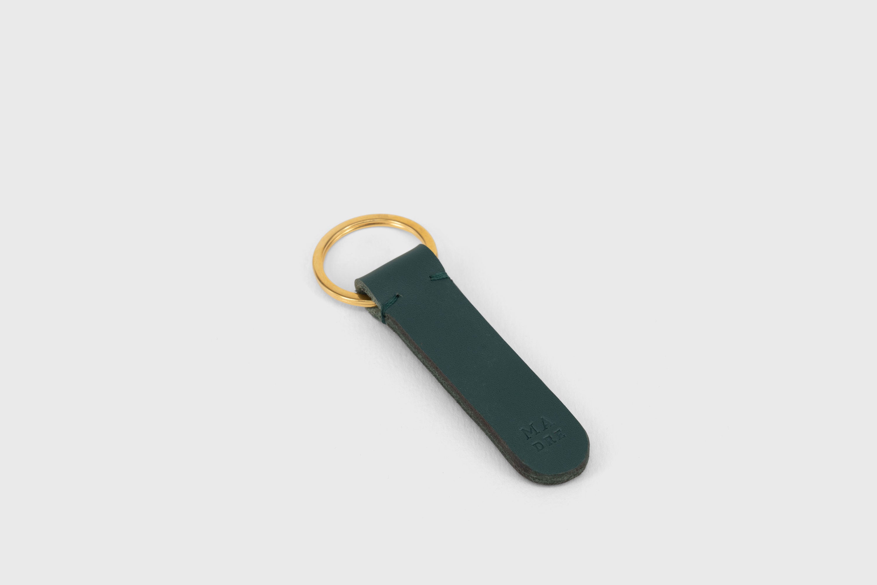 Key Ring Leather Teal Color Fob Minimalist Designer Vegetable Tanned Full Grain Handcrafted Personalised Premium Quality Gold Atelier Madre Manuel Dreesmann Barcelona Spain