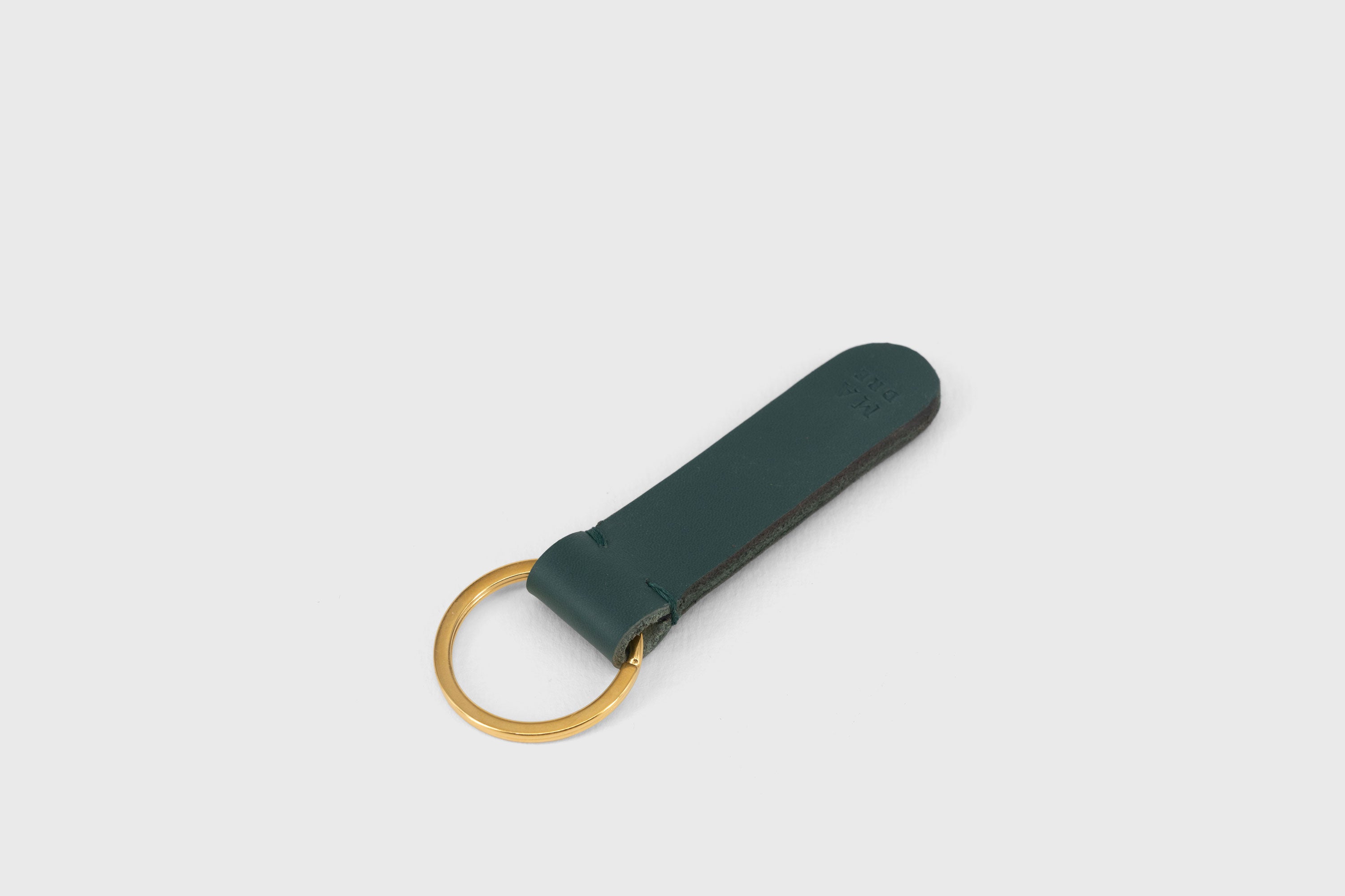 Key Ring Leather Teal Color Fob Minimalist Designer Vegetable Tanned Full Grain Handcrafted Personalised Premium Quality Gold Atelier Madre Manuel Dreesmann Barcelona Spain