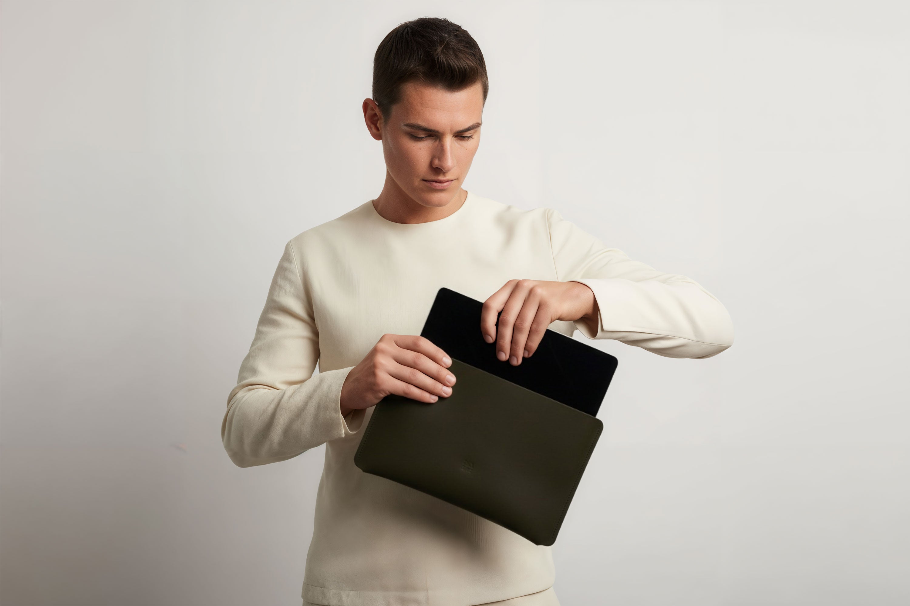 Leather Sleeve for iPad Leather Horizontal Olive Green On Model Minimal Design Atelier Madre Manuel Dreesmann Barcelona
