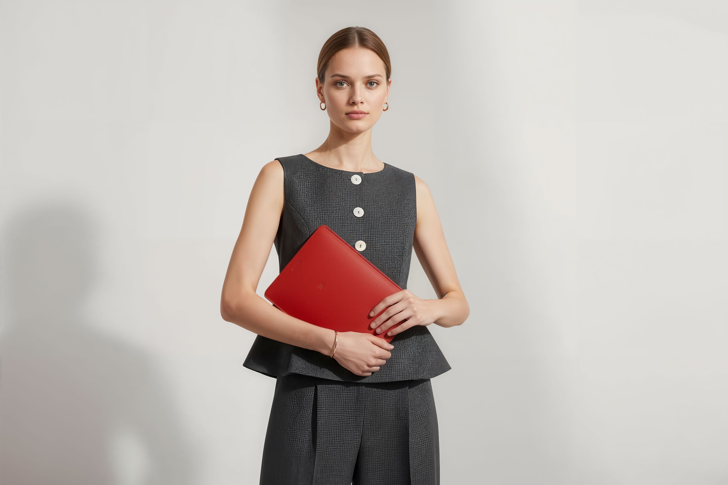 Leather Sleeve for iPad Leather Vertical Red On Model Minimal Design Atelier Madre Manuel Dreesmann Barcelona