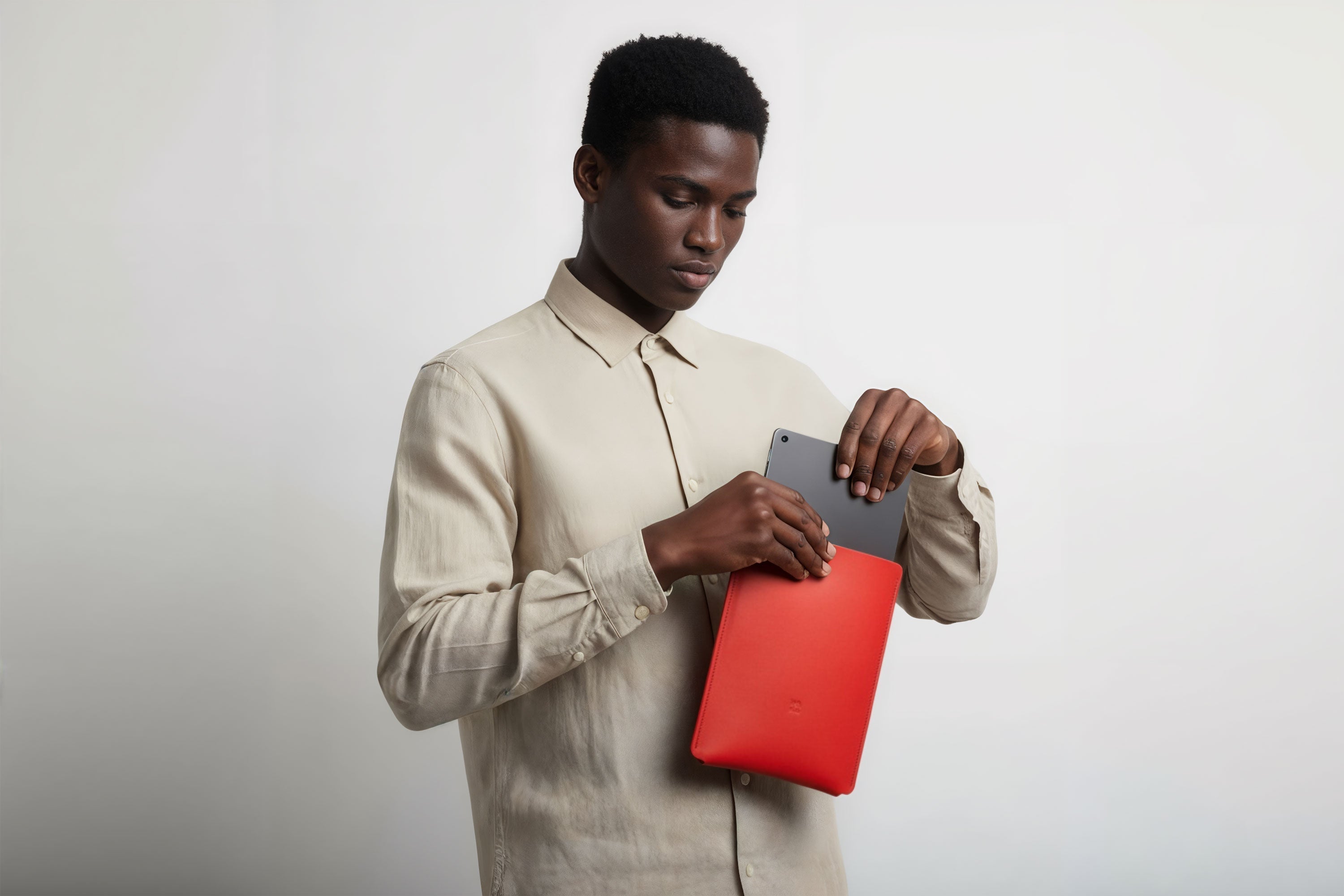 Leather Sleeve for iPad Leather Vertical Red On Model Minimal Design Atelier Madre Manuel Dreesmann Barcelona