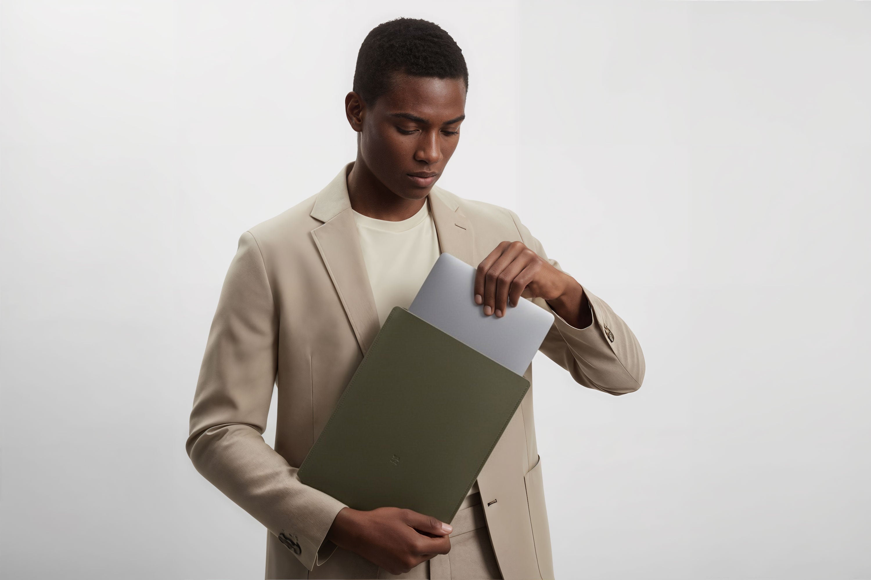 MacBook Slip Sleeve Olive Green Color Leather On Model Grey Background Minimalistic Premium Design Atelier Madre Manuel Dreesmann Barcelona