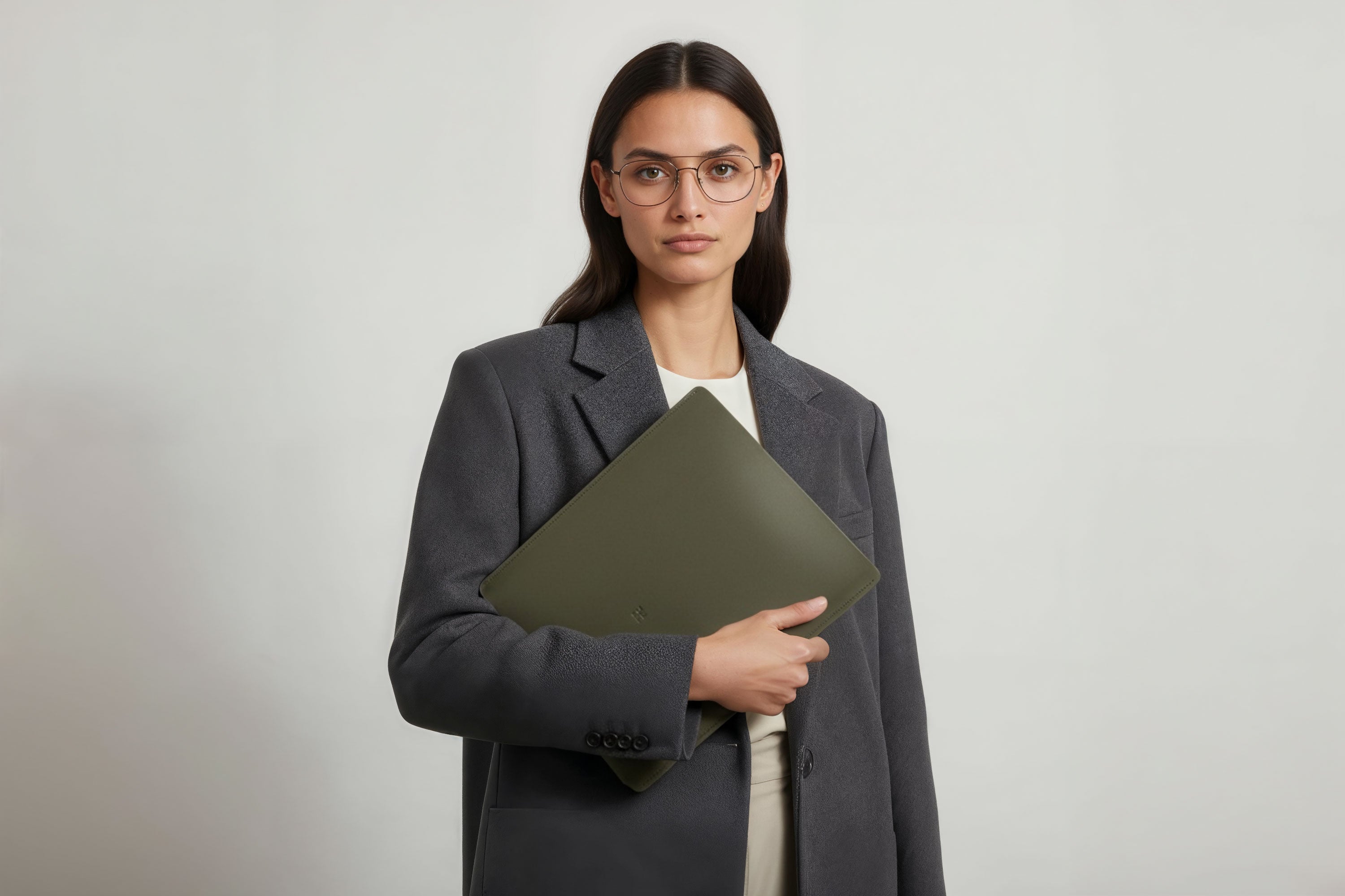 MacBook Slip Sleeve Olive Green Color Leather On Model Grey Background Minimalistic Premium Design Atelier Madre Manuel Dreesmann Barcelona