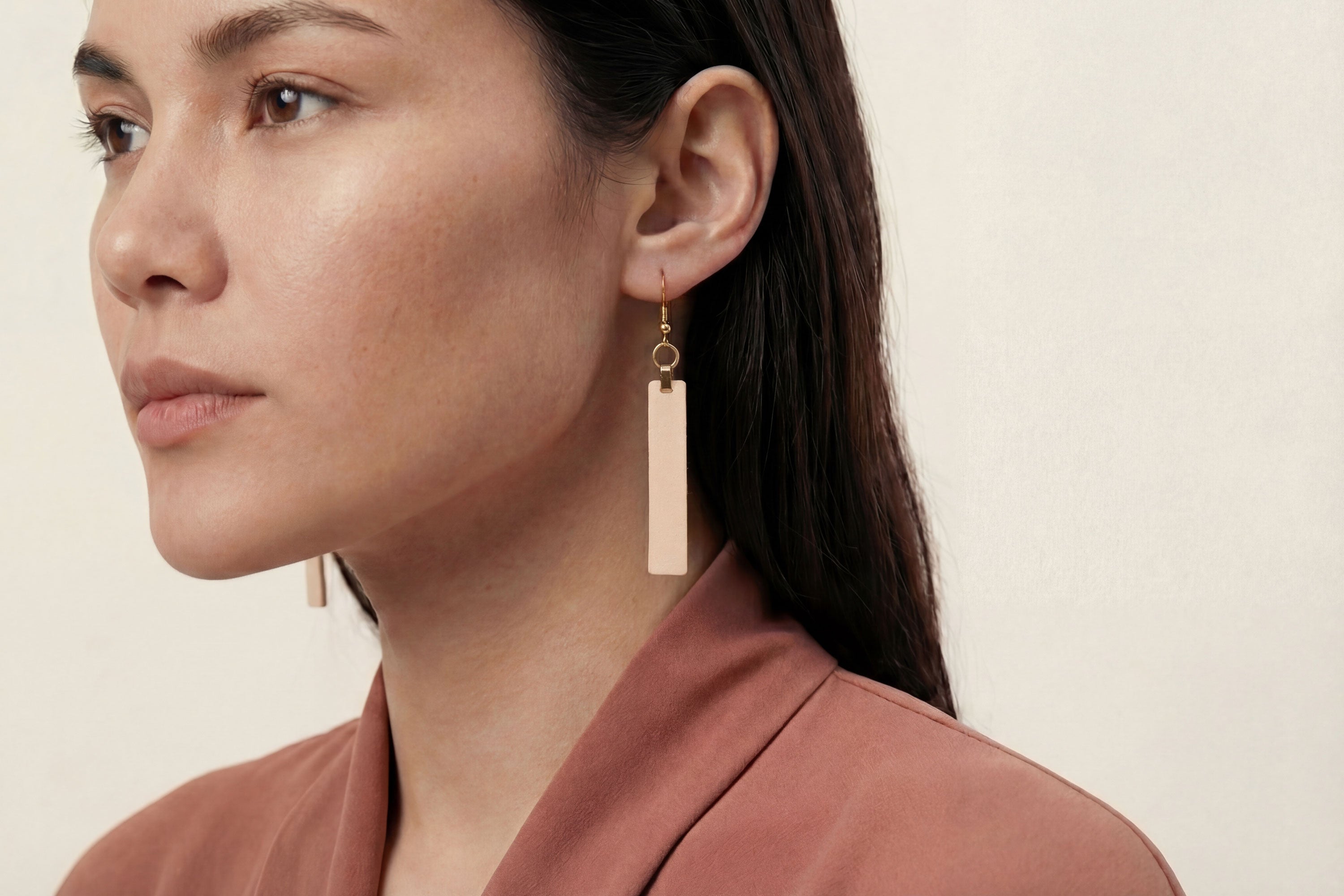Lia Earrings Leather In Natural Color On Model Vegetable Tanned Leather Atelier Madre Manuel Dreesmann Barcelona Spain