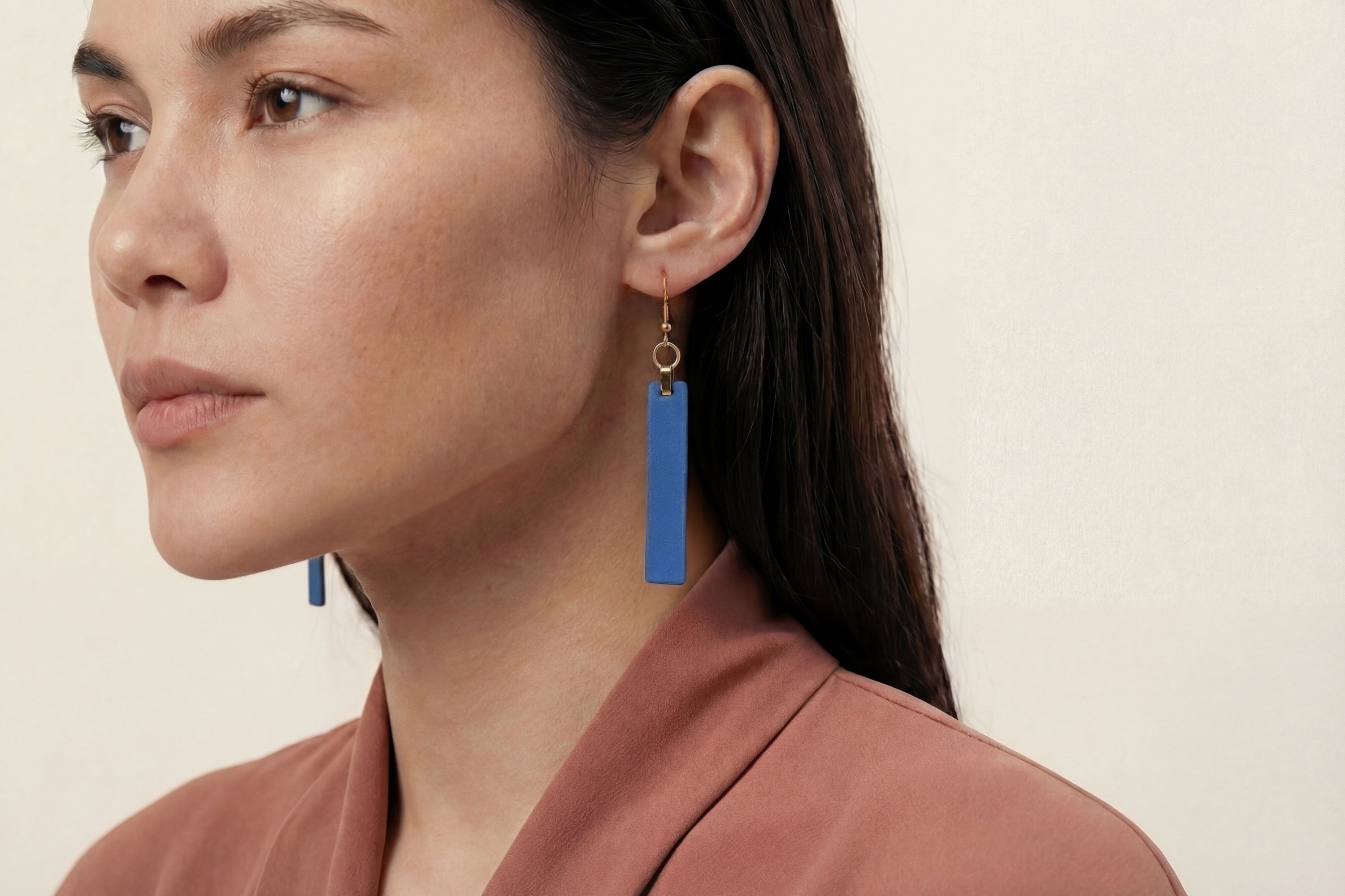 Lia Earrings Leather In Royal Blue Color On Model Vegetable Tanned Leather Atelier Madre Manuel Dreesmann Barcelona Spain