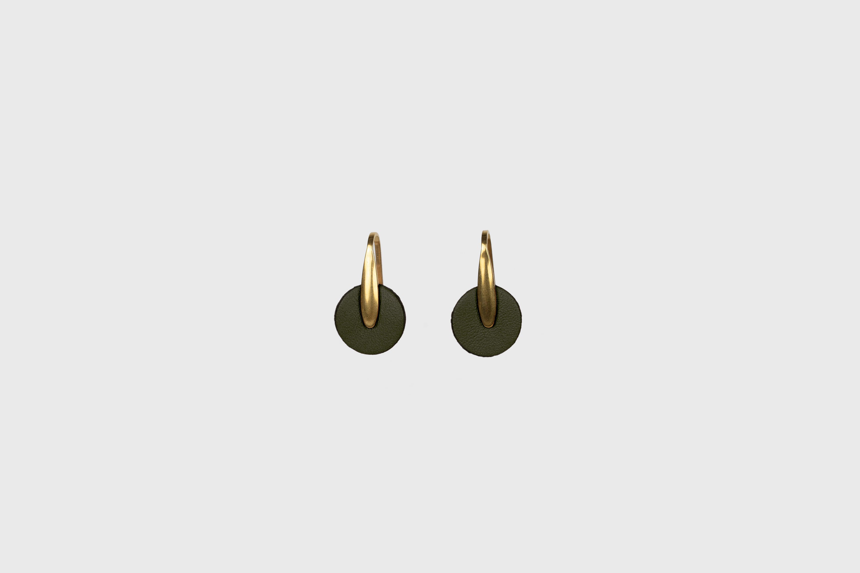 Lina Earrings In Olive Green Color In Vegetable Tanned Leather Brass Hook Minimalistic Design Atelier Madre Manuel Dreesmann Barcelona Spain