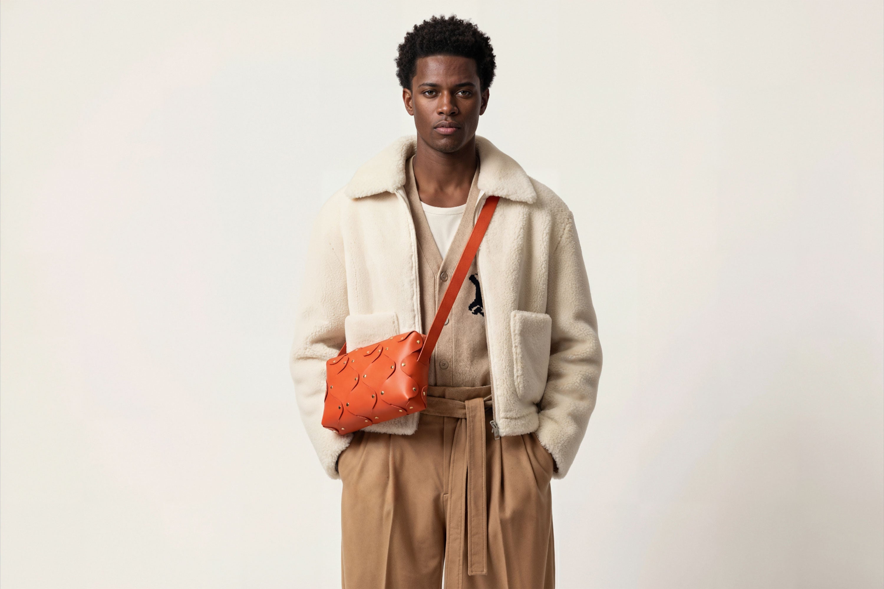 Marlin Leather Bag Orange On A Man Model Quality Brass Rivet Designer Minimal Square Zipper Pouch Crossbody Handbag Clutch Shoulder Atelier Madre Manuel Dreesmann Barcelona
