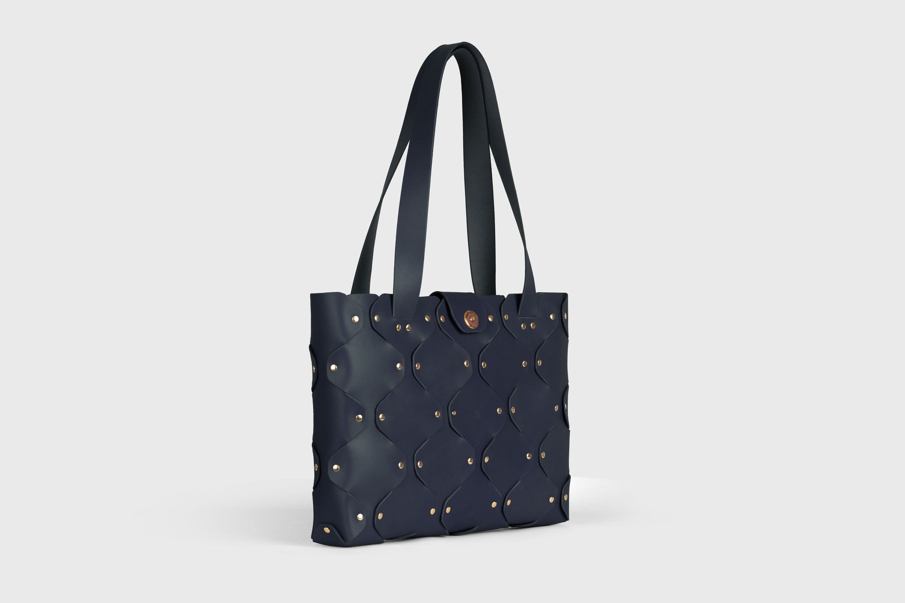 Marlin Tote Bag In Marine Blue Color In Vegetable Tanned Leather With Rivets Atelier Madre Manuel Dreesmann Barcelona Spain