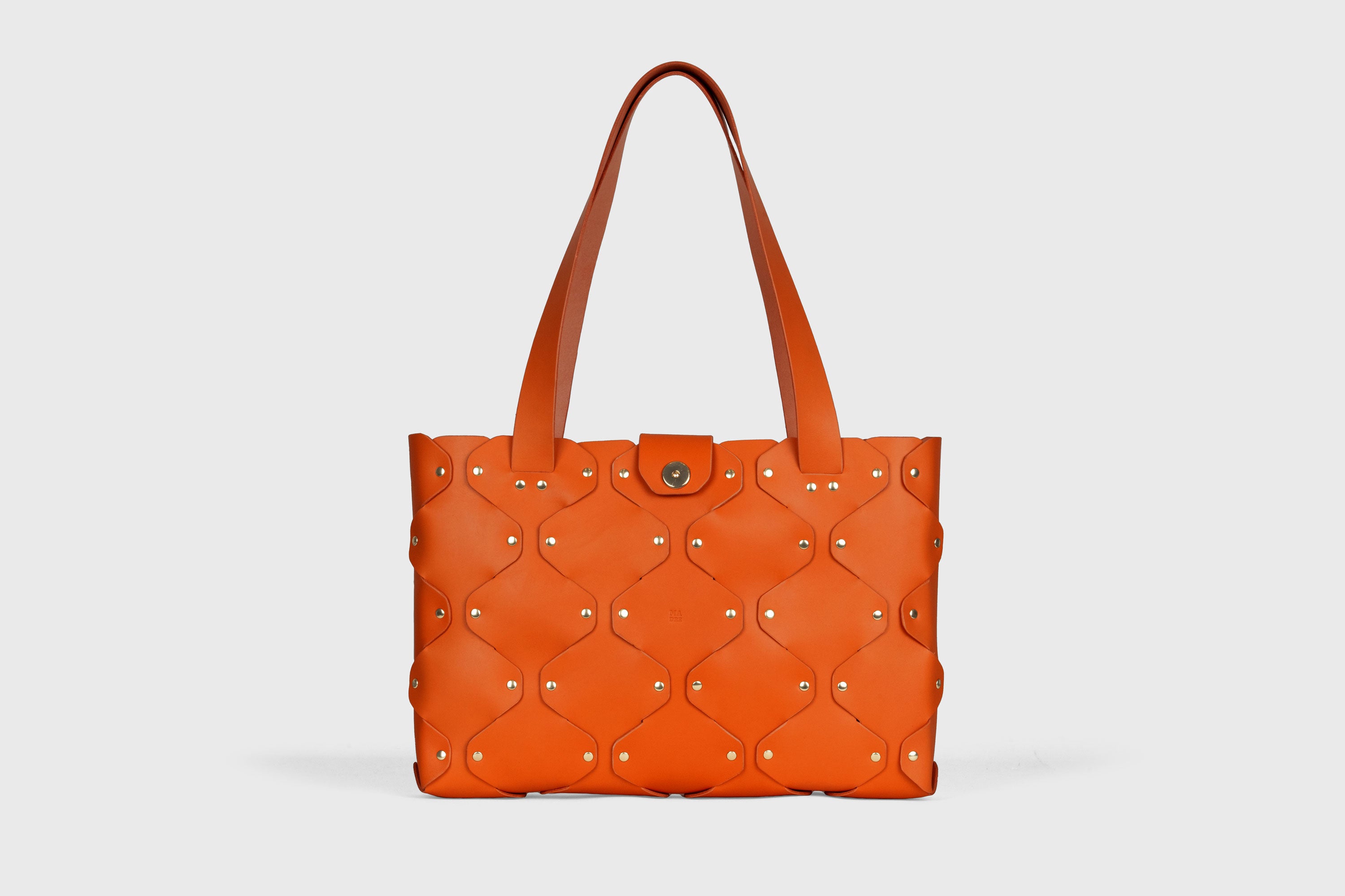 Marlin Tote Bag In Orange Color In Vegetable Tanned Leather With Rivets Atelier Madre Manuel Dreesmann Barcelona Spain