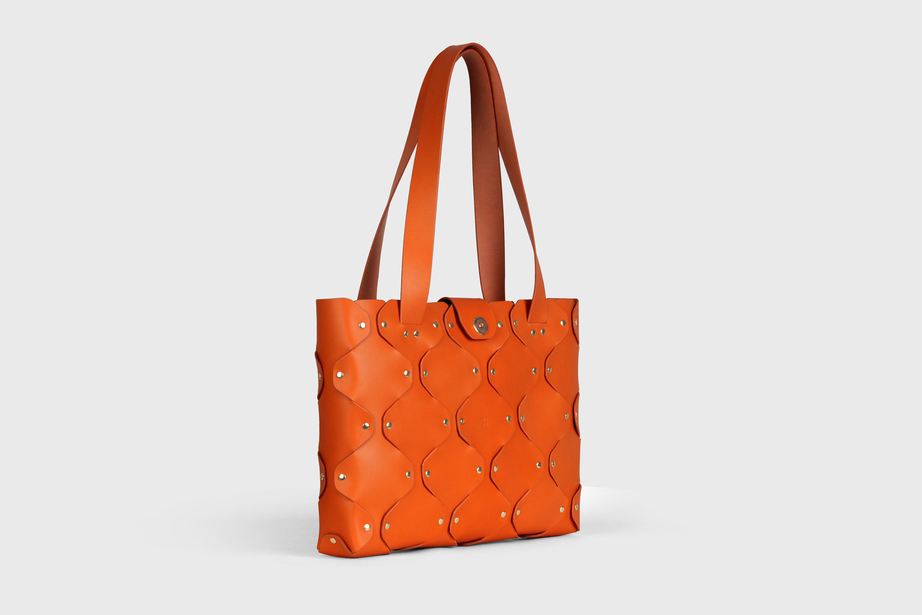 Marlin Tote Bag In Orange Color In Vegetable Tanned Leather With Rivets Atelier Madre Manuel Dreesmann Barcelona Spain