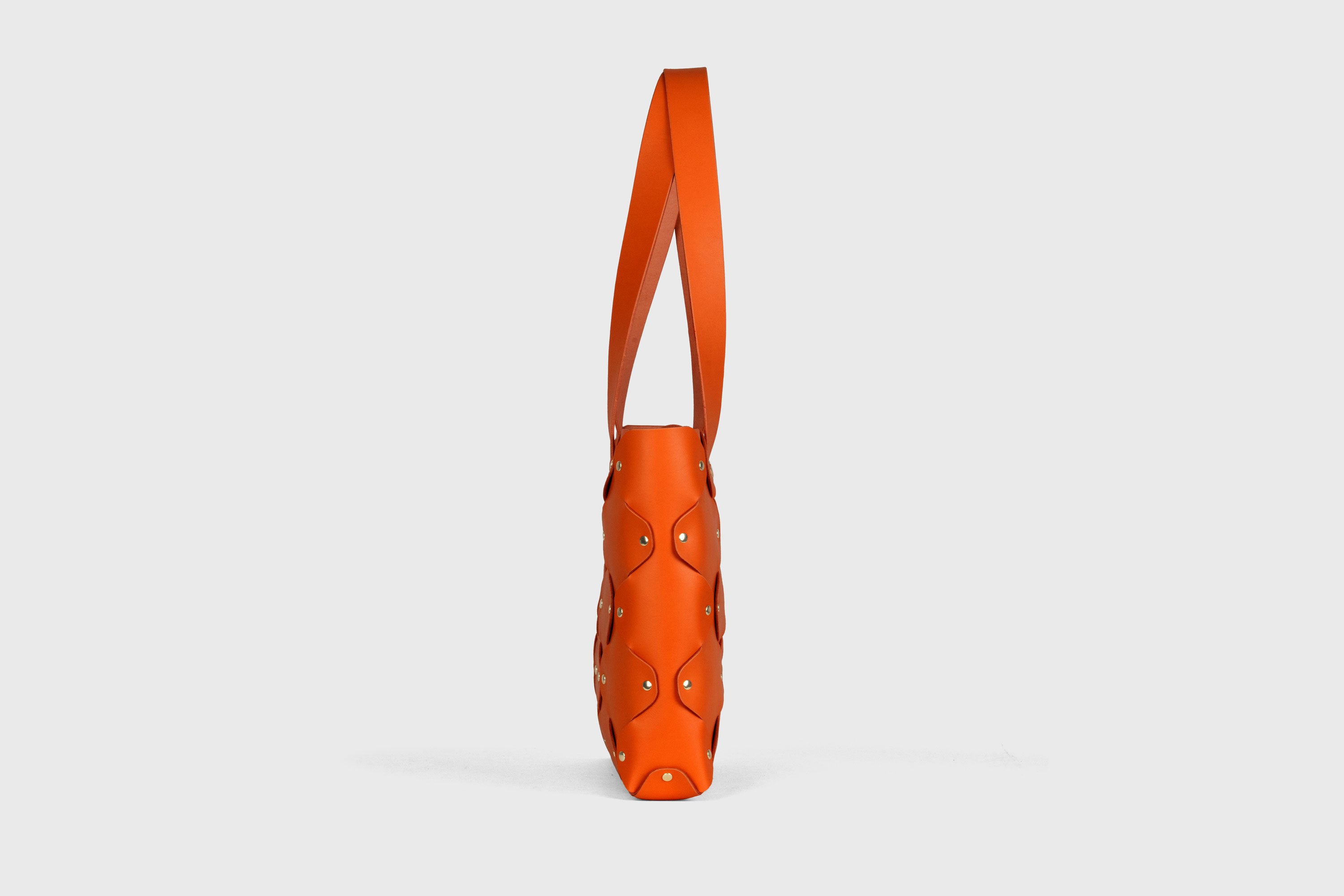 Marlin Tote Bag In Orange Color In Vegetable Tanned Leather With Rivets Atelier Madre Manuel Dreesmann Barcelona Spain