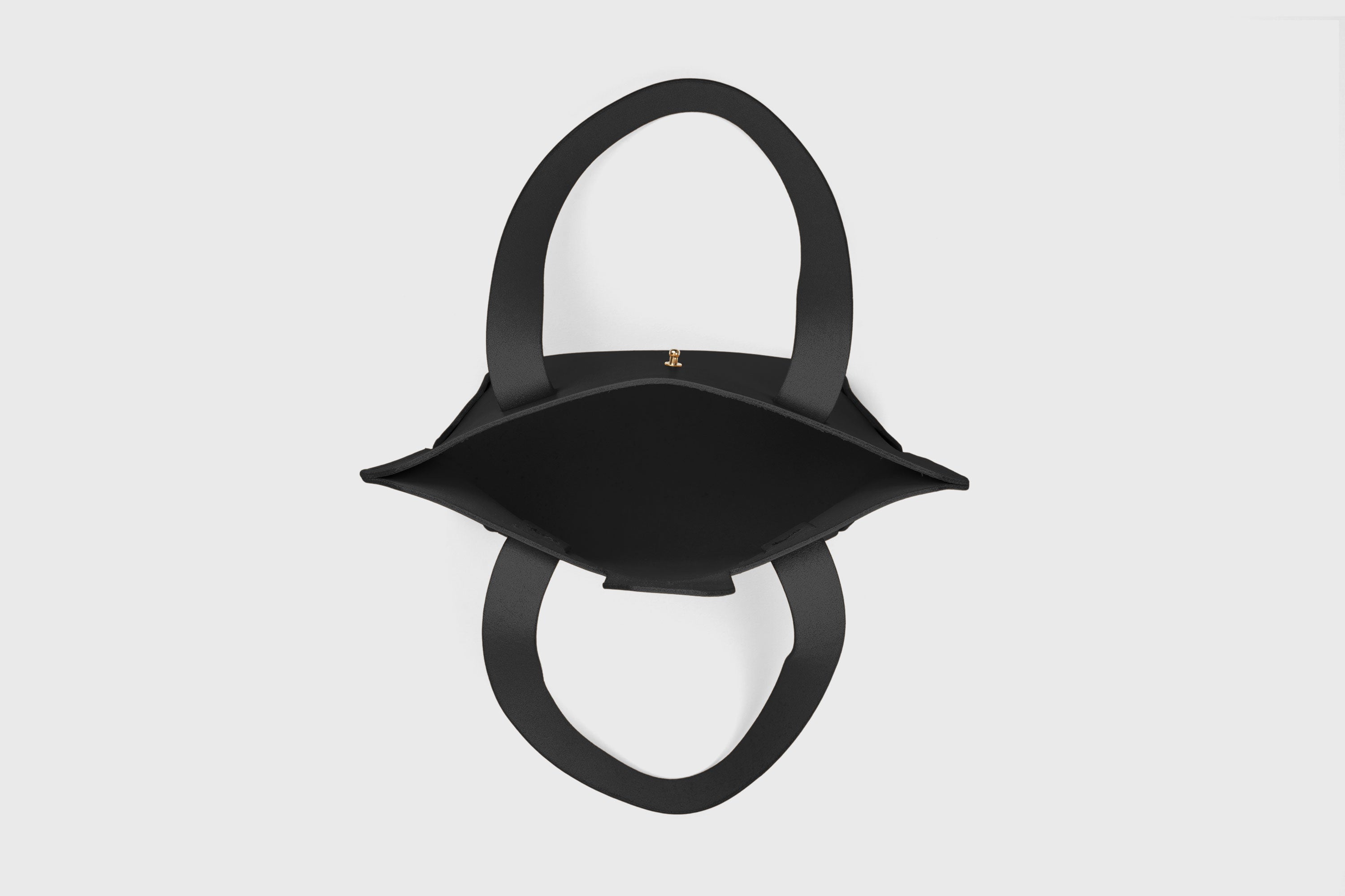 Medium Tote Bag With Flap In Black Colour In Vegetable Tanned Leather Minimalistic Design Atelier Madre Manuel Dreesmann Barcelona Spain