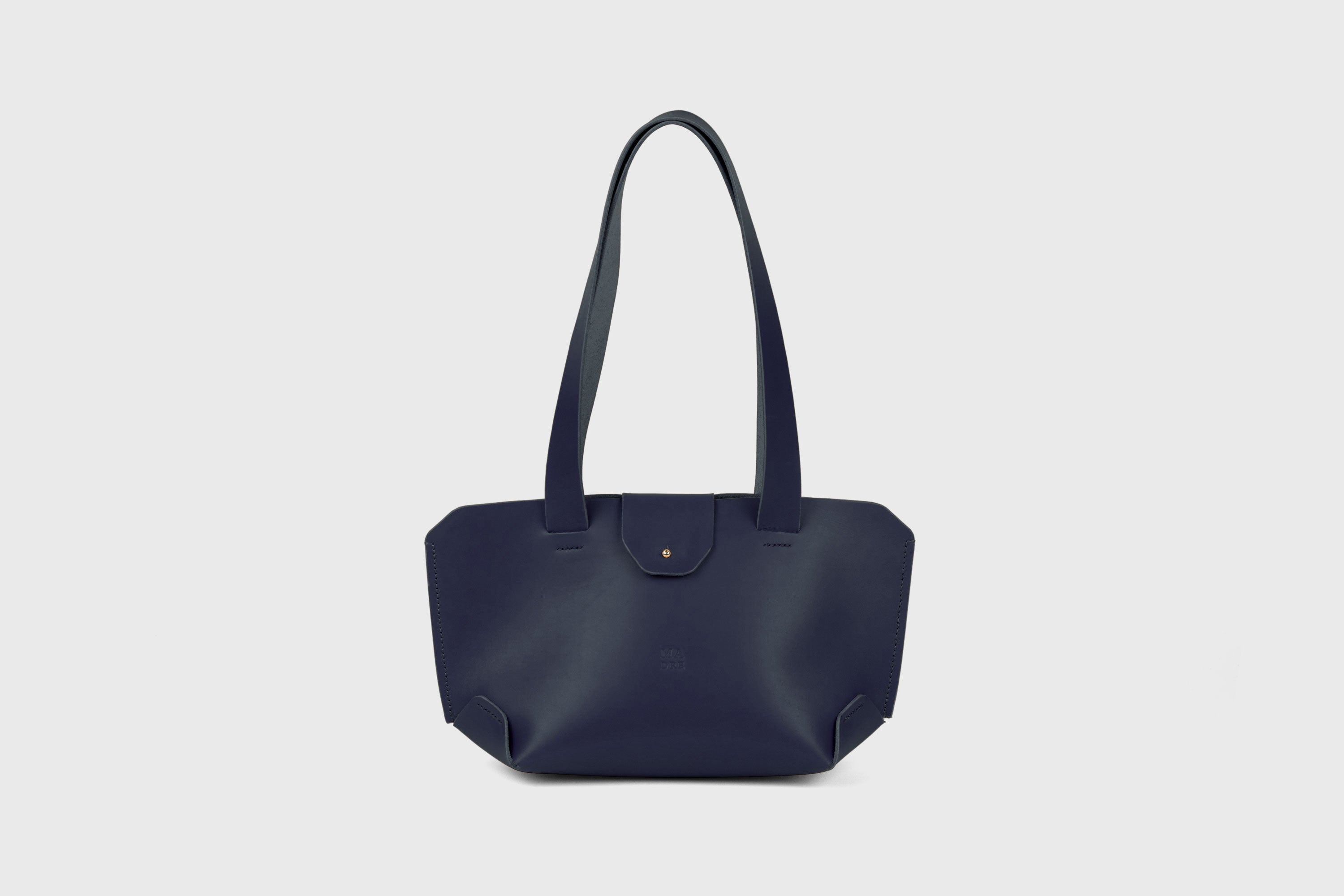 Medium Tote Bag With Flap In Marine Blue In Vegetable Tanned Leather Minimalistic Design Atelier Madre Manuel Dreesmann Barcelona Spain