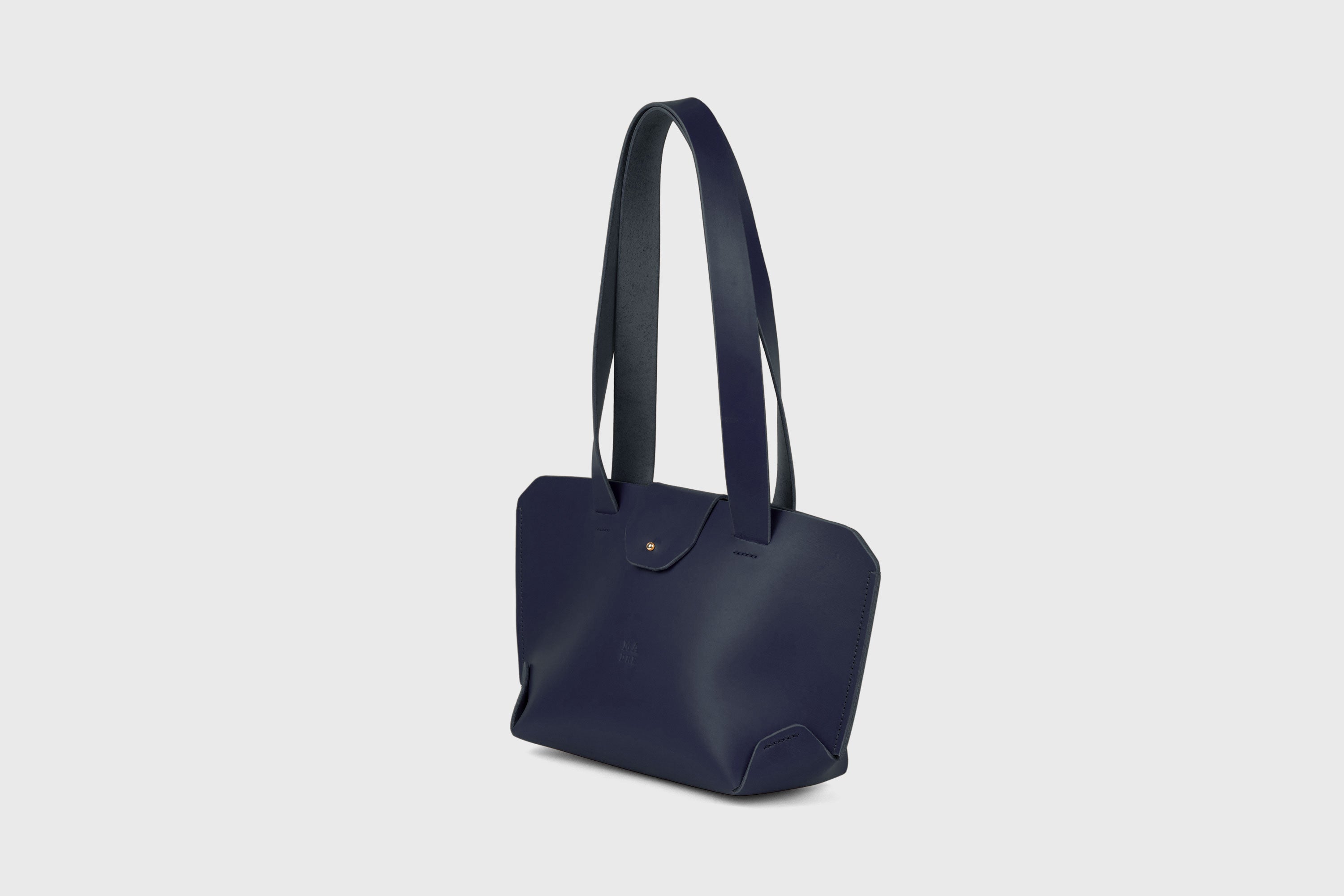 Medium Tote Bag With Flap In Marine Blue In Vegetable Tanned Leather Minimalistic Design Atelier Madre Manuel Dreesmann Barcelona Spain