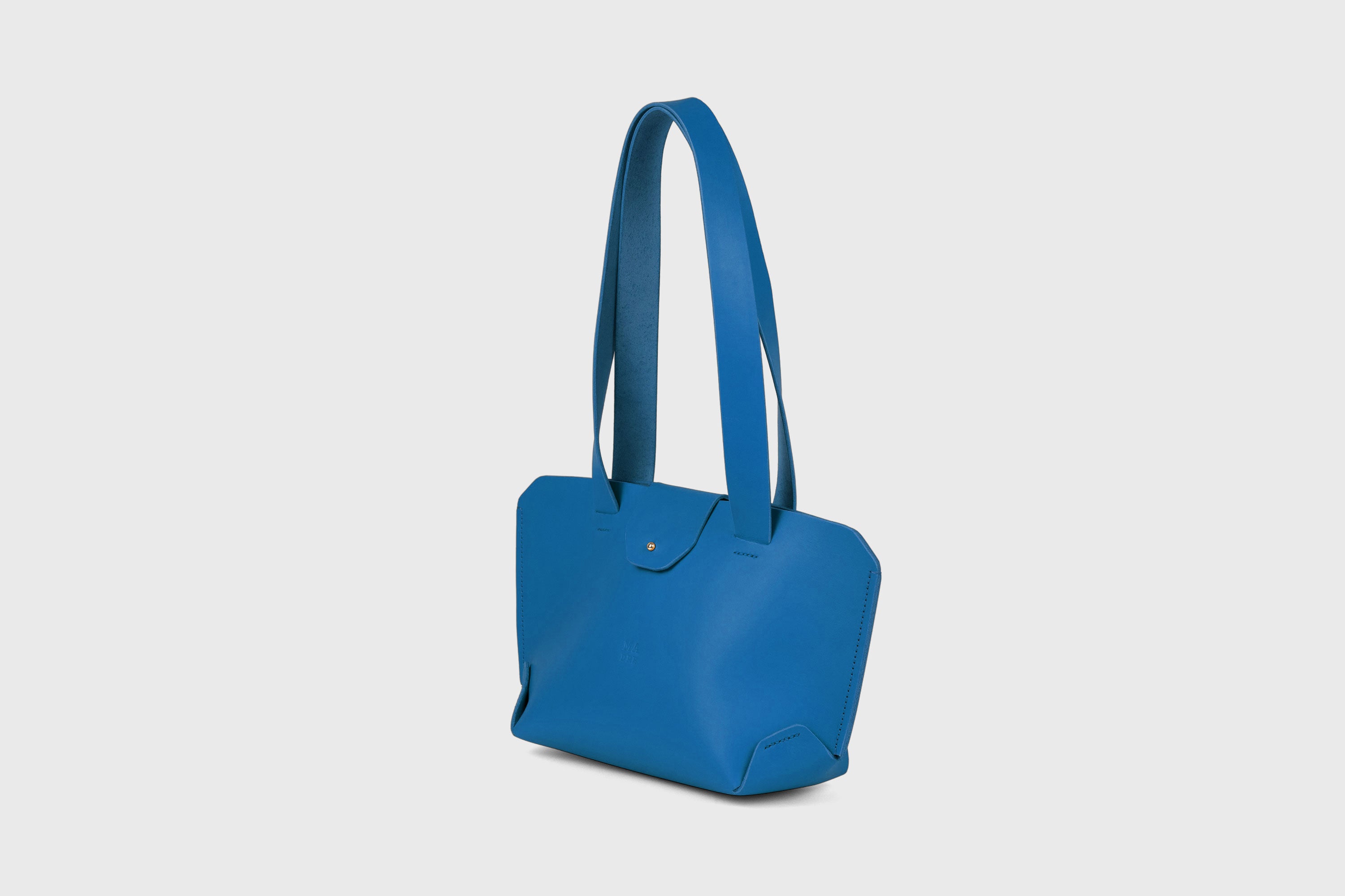 Medium Tote Bag With Flap In Royal Blue In Vegetable Tanned Leather Minimalistic Design Atelier Madre Manuel Dreesmann Barcelona Spain
