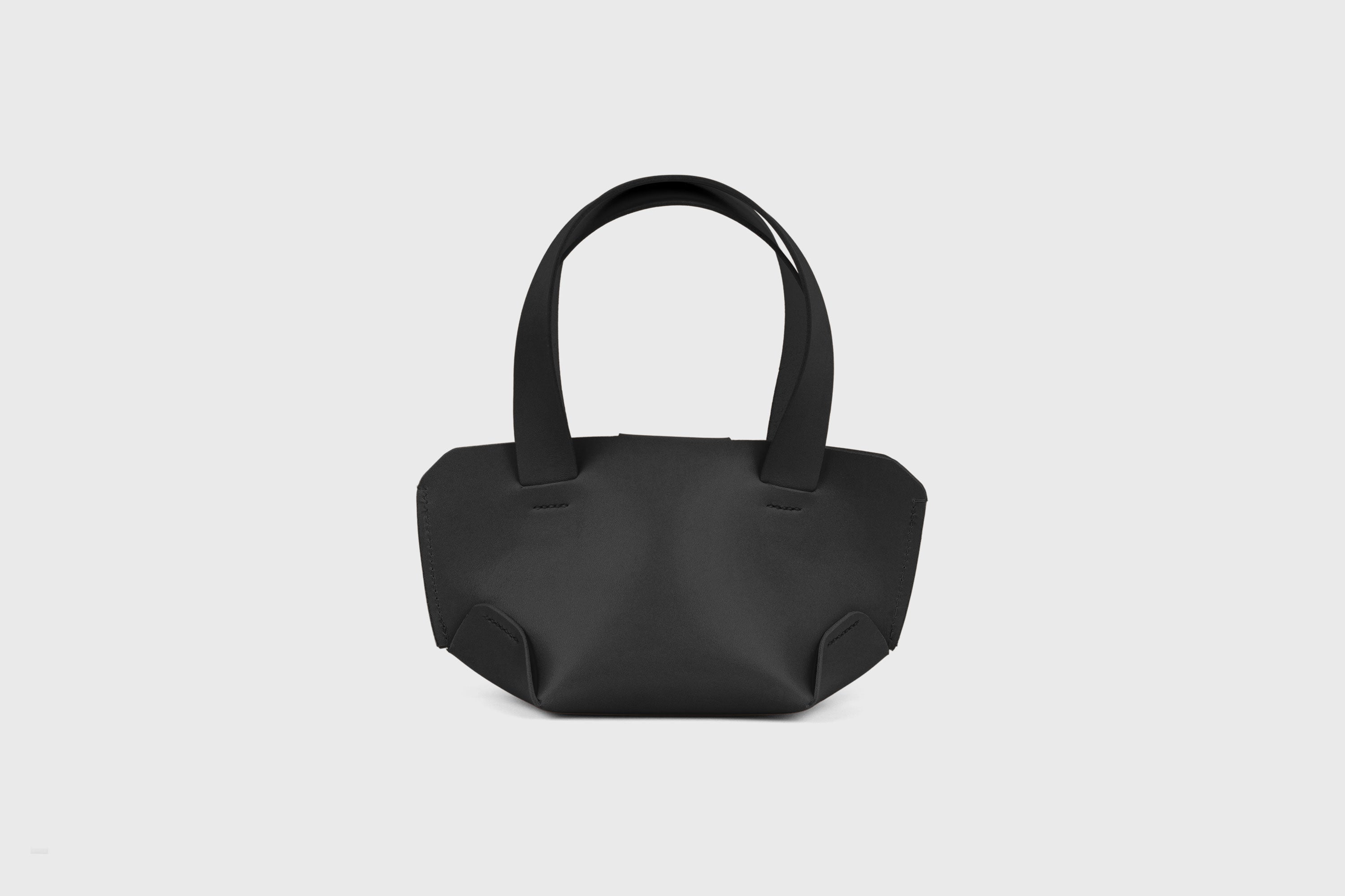Mini Tote Bag In Black Color In Vegetable Tanned Leather Bag With A Flap In Minimalistic Design Atelier Madre Manuel Dreesmann 