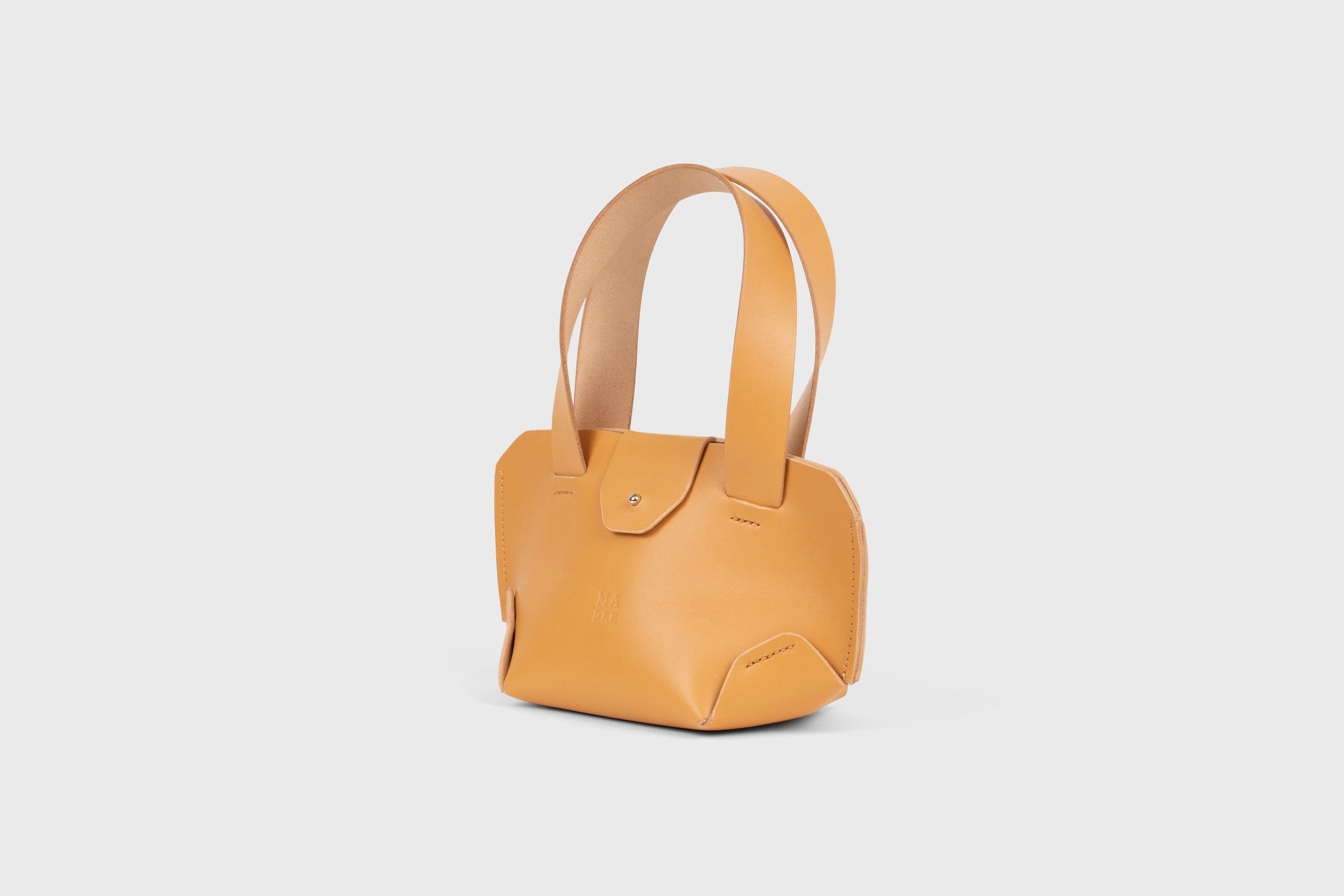 Mini Tote Bag In Brown Color In Vegetable Tanned Leather Bag With A Flap In Minimalistic Design Atelier Madre Manuel Dreesmann 