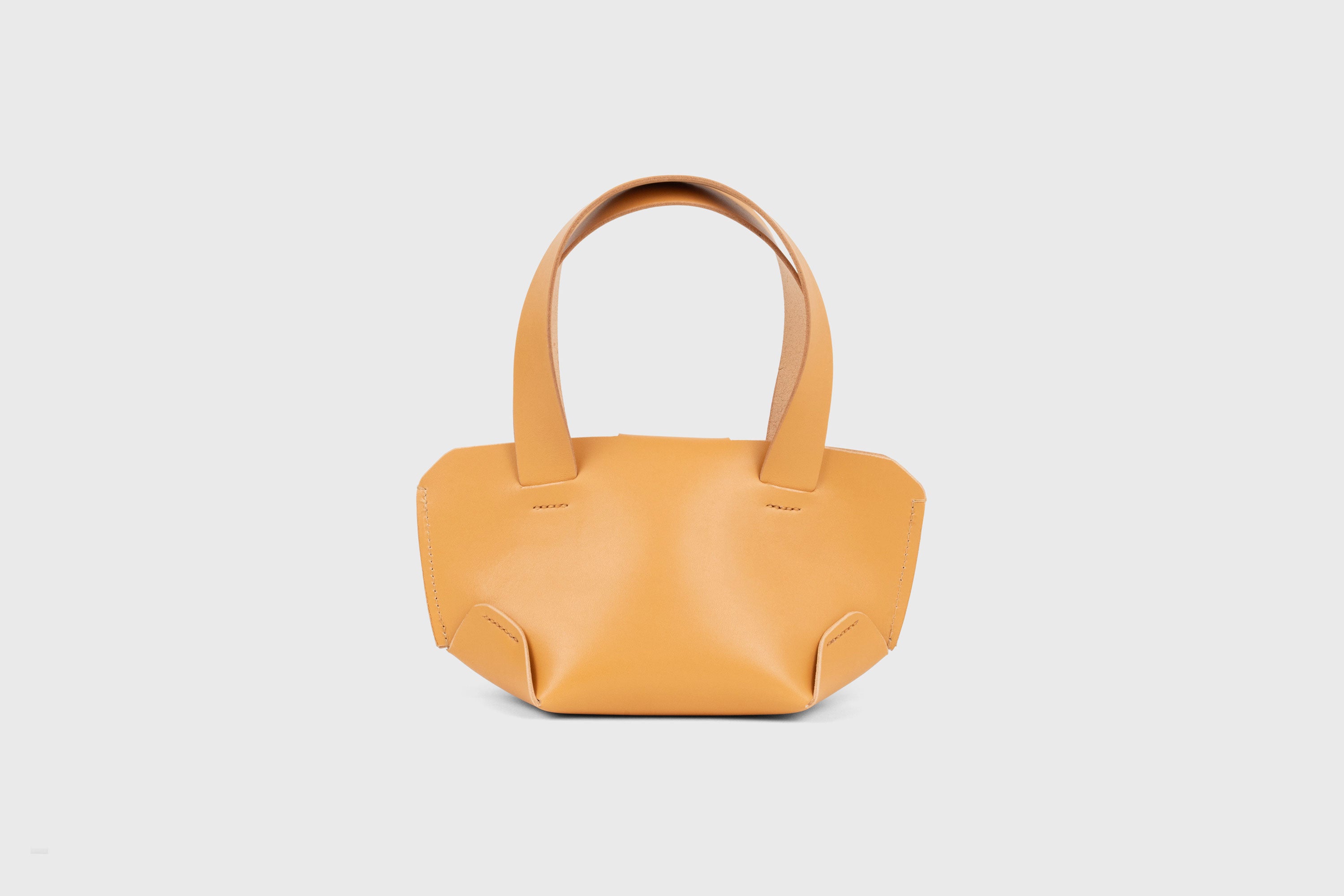 Mini Tote Bag In Brown Color In Vegetable Tanned Leather Bag With A Flap In Minimalistic Design Atelier Madre Manuel Dreesmann 