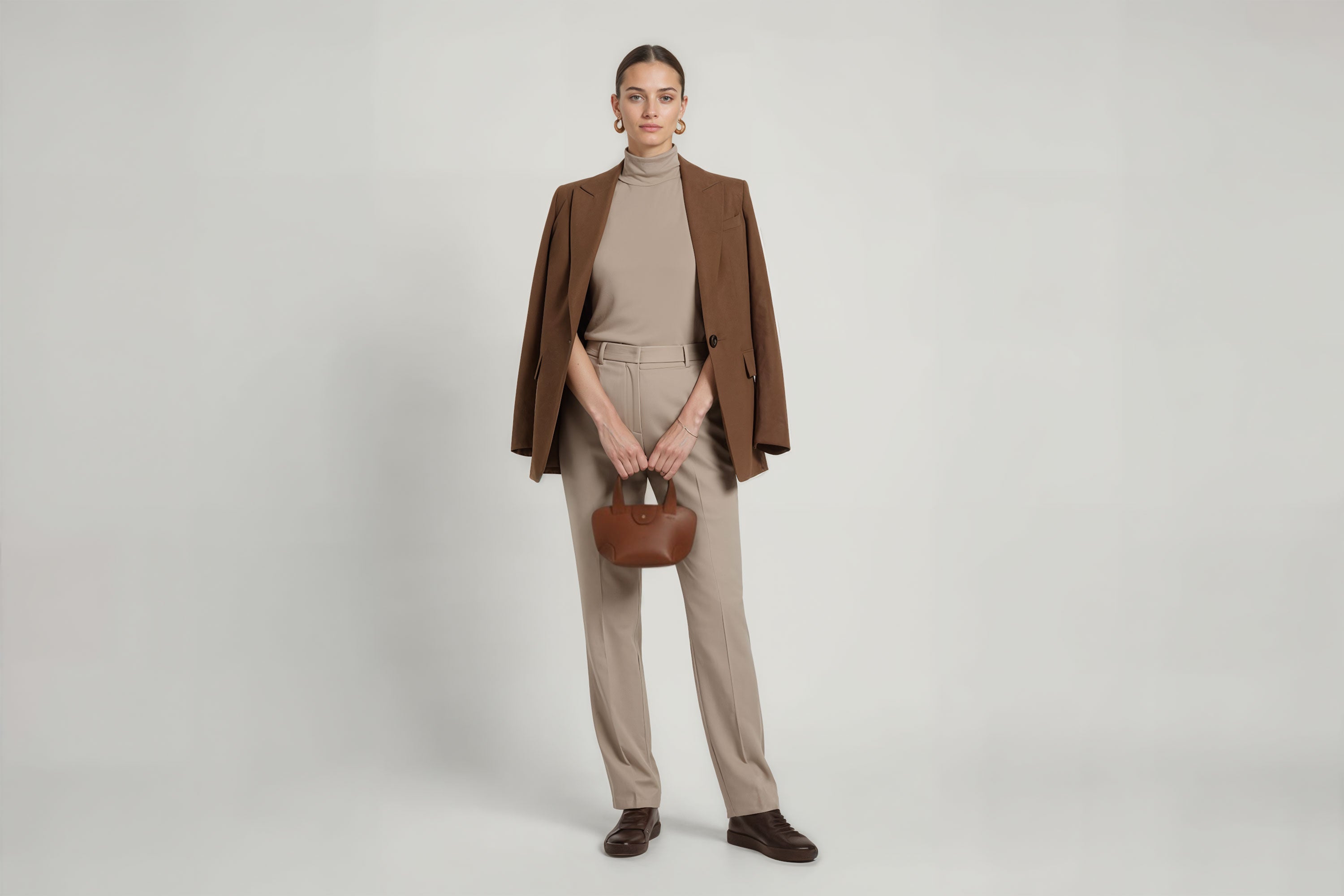 Mini Tote Bag Dark Brown Color Leather On A Woman Model Handbag Small Modern Minimalist Design Premium Quality Atelier Madre Manuel Dreesmann Barcelona Spain