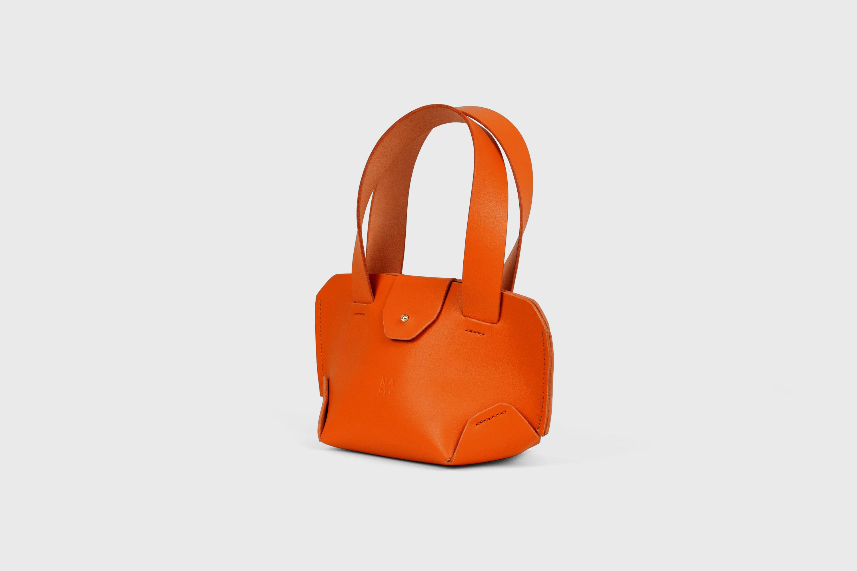 Mini Tote Bag In Orange Color In Vegetable Tanned Leather Bag With A Flap In Minimalistic Design Atelier Madre Manuel Dreesmann 