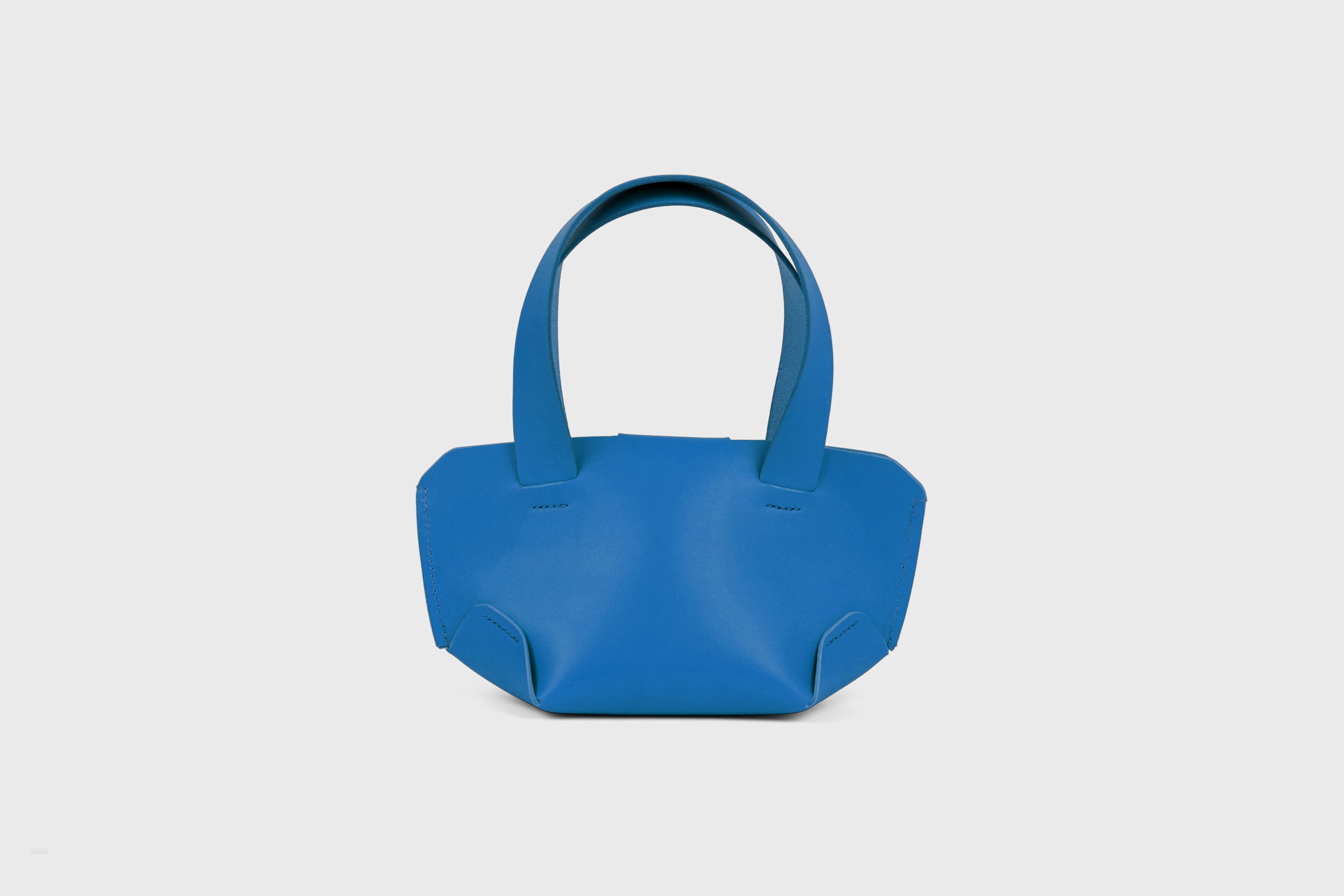 Mini Tote Bag In Royal Blue Color In Vegetable Tanned Leather Bag With A Flap In Minimalistic Design Atelier Madre Manuel Dreesmann 