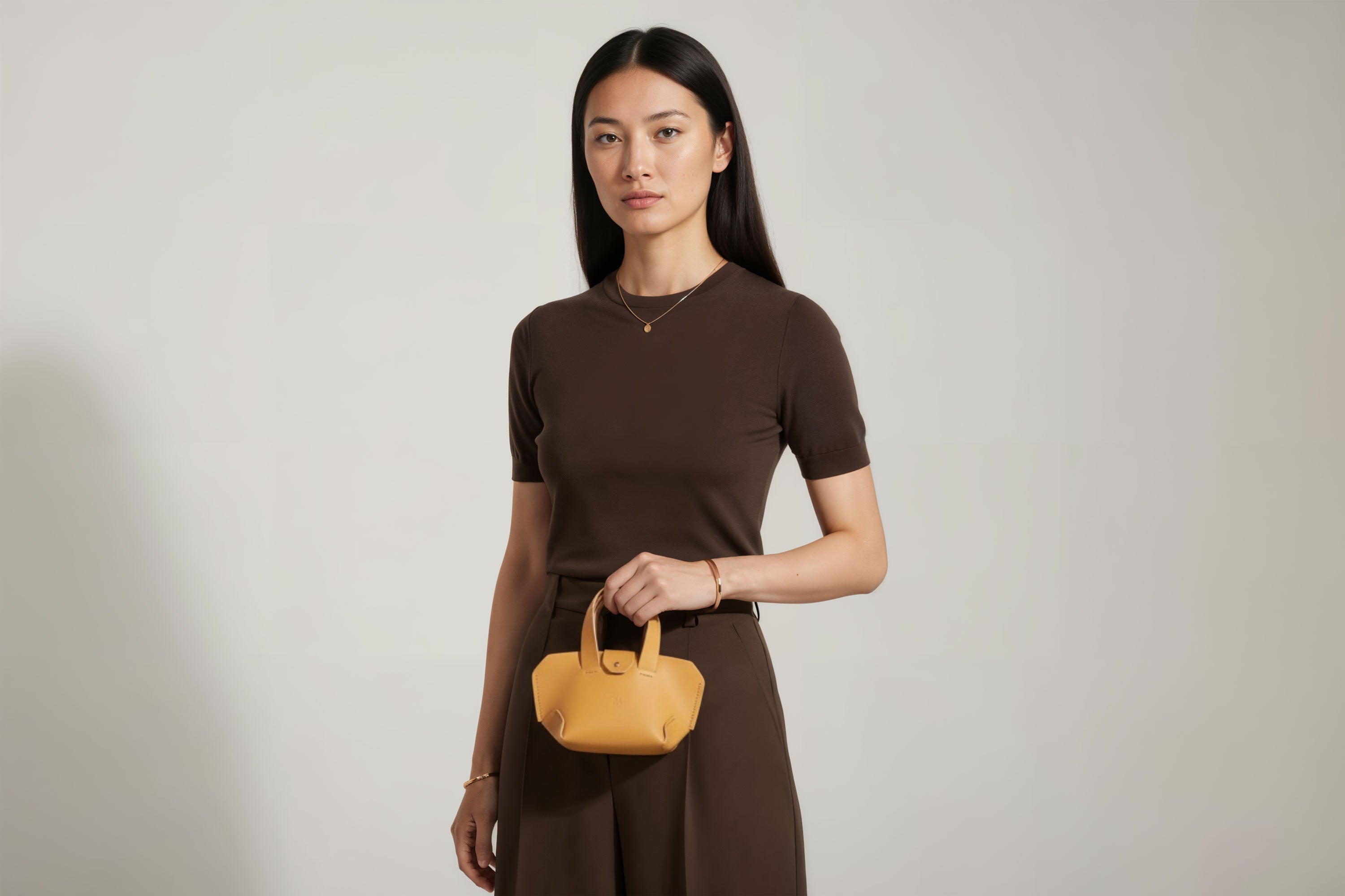 Nano Leather Tote Bag Brown Color On A Woman Model Premium Quality Minimalist Design Atelier Madre Manuel Dreesmann Barcelona Spain