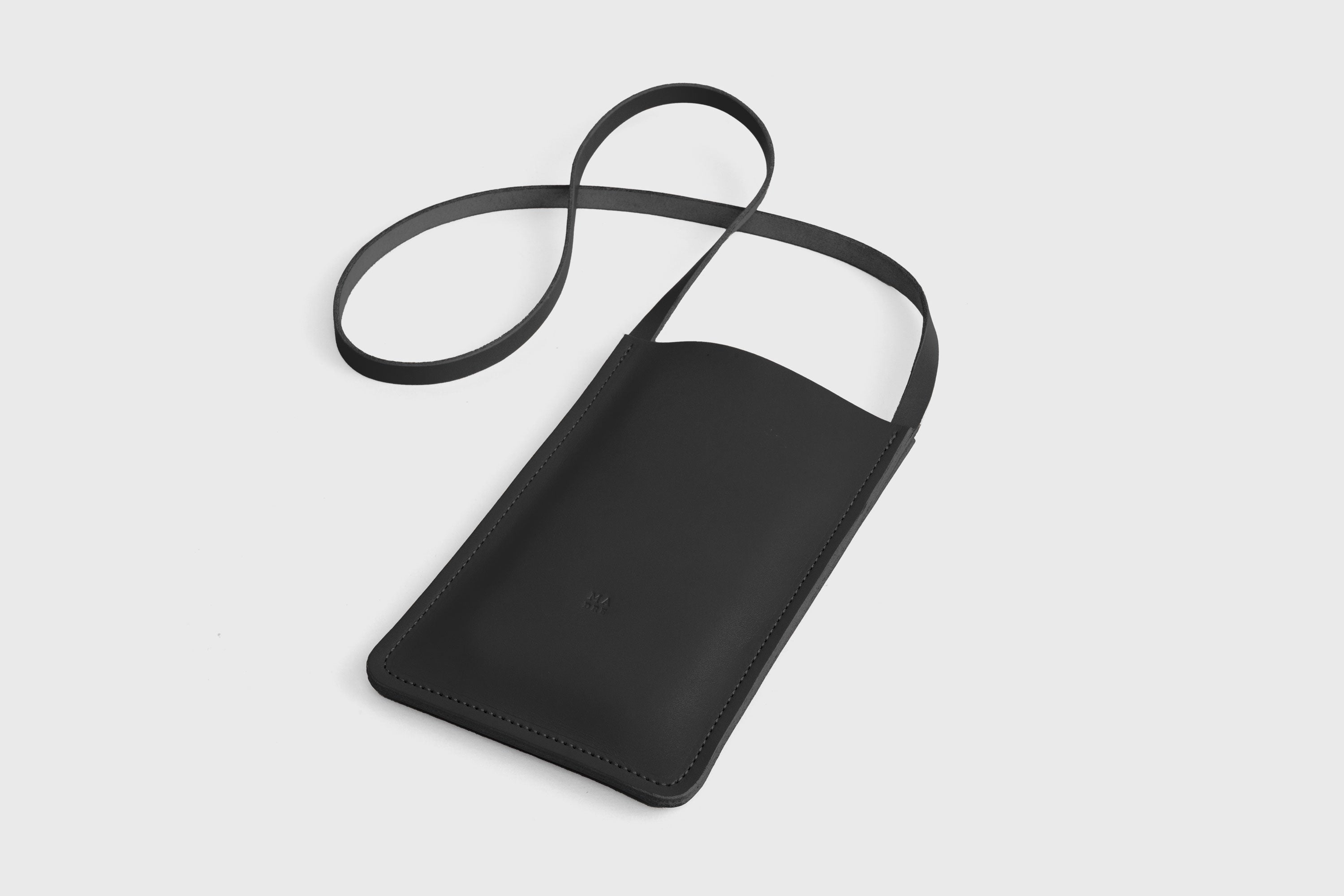 Neck Pouch Leather In Black Color Vegetable Tanned Leather Minimalistic Design Atelier Madre Manuel Dreesmann Barcelona Spain