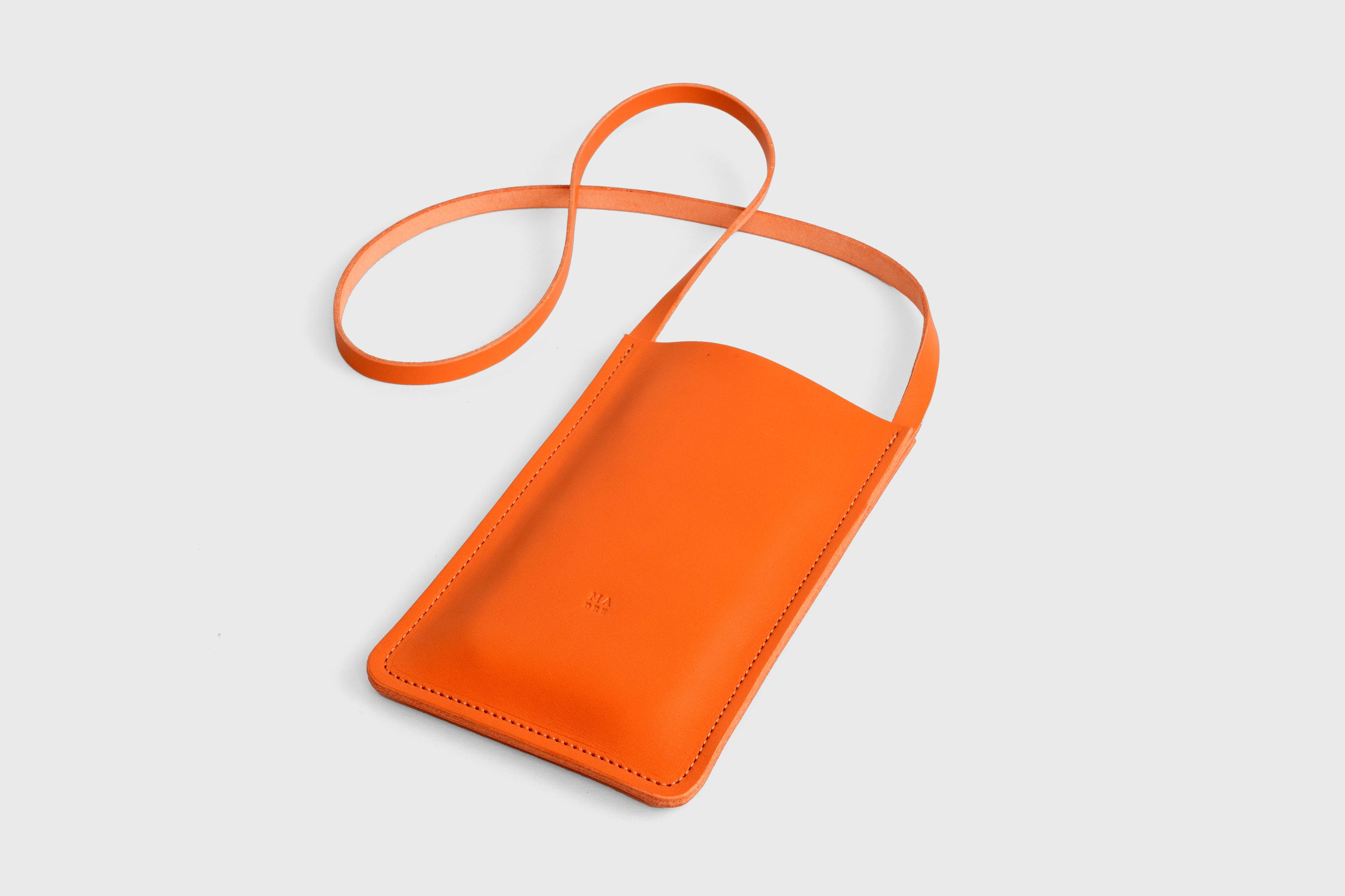 Neck Pouch Leather In Orange Color Vegetable Tanned Leather Minimalistic Design Atelier Madre Manuel Dreesmann Barcelona Spain
