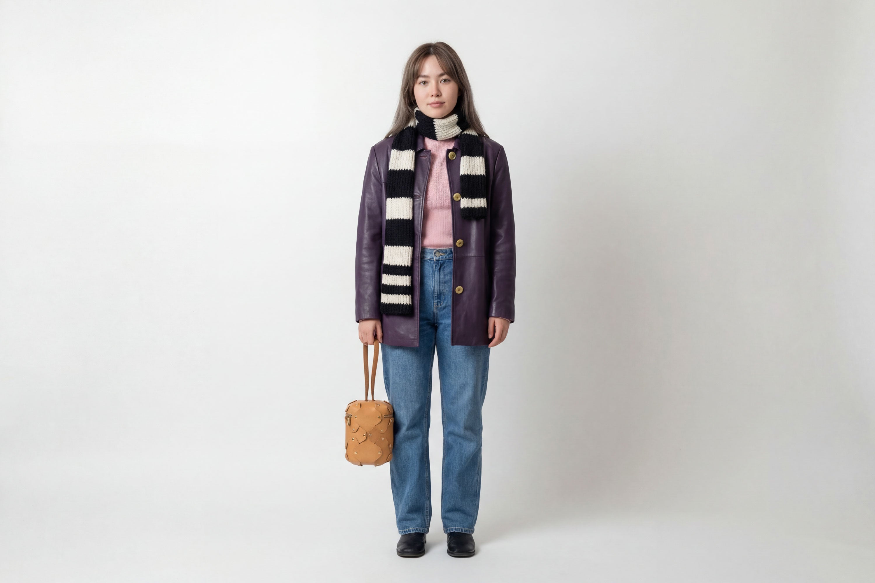 Nema Leather Bag Brown Color On A Woman Model Vegetable Tanned Full Grain Spain Brass Rivets Premium Design Minimalist Modern Cylinder Circle Round Zipper Pouch Handbag  Atelier Madre Manuel Dreesmann Barcelona