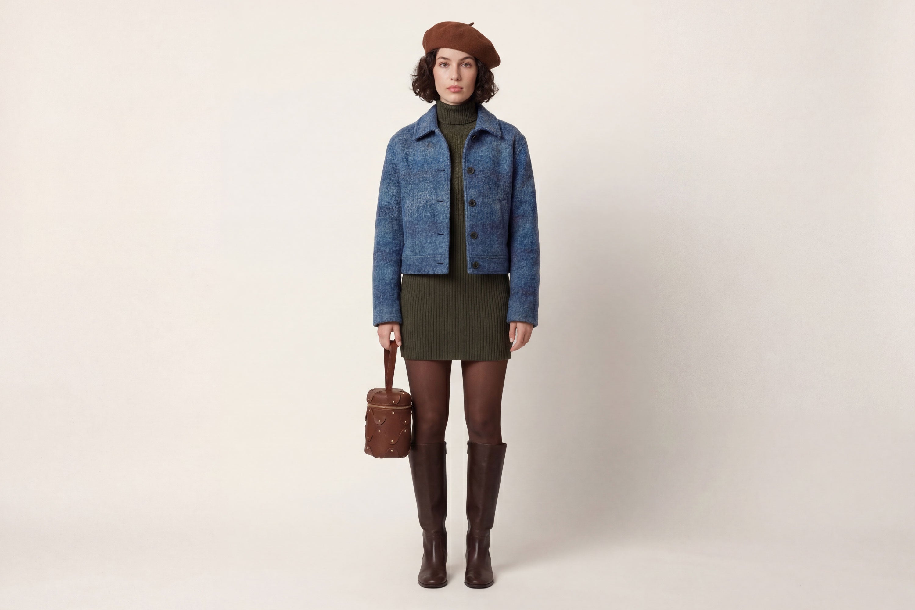 Nema Leather Bag Dark Brown Color On A Woman Model Vegetable Tanned Full Grain Spain Brass Rivets Premium Design Minimalist Modern Cylinder Circle Round Zipper Pouch Handbag  Atelier Madre Manuel Dreesmann Barcelona