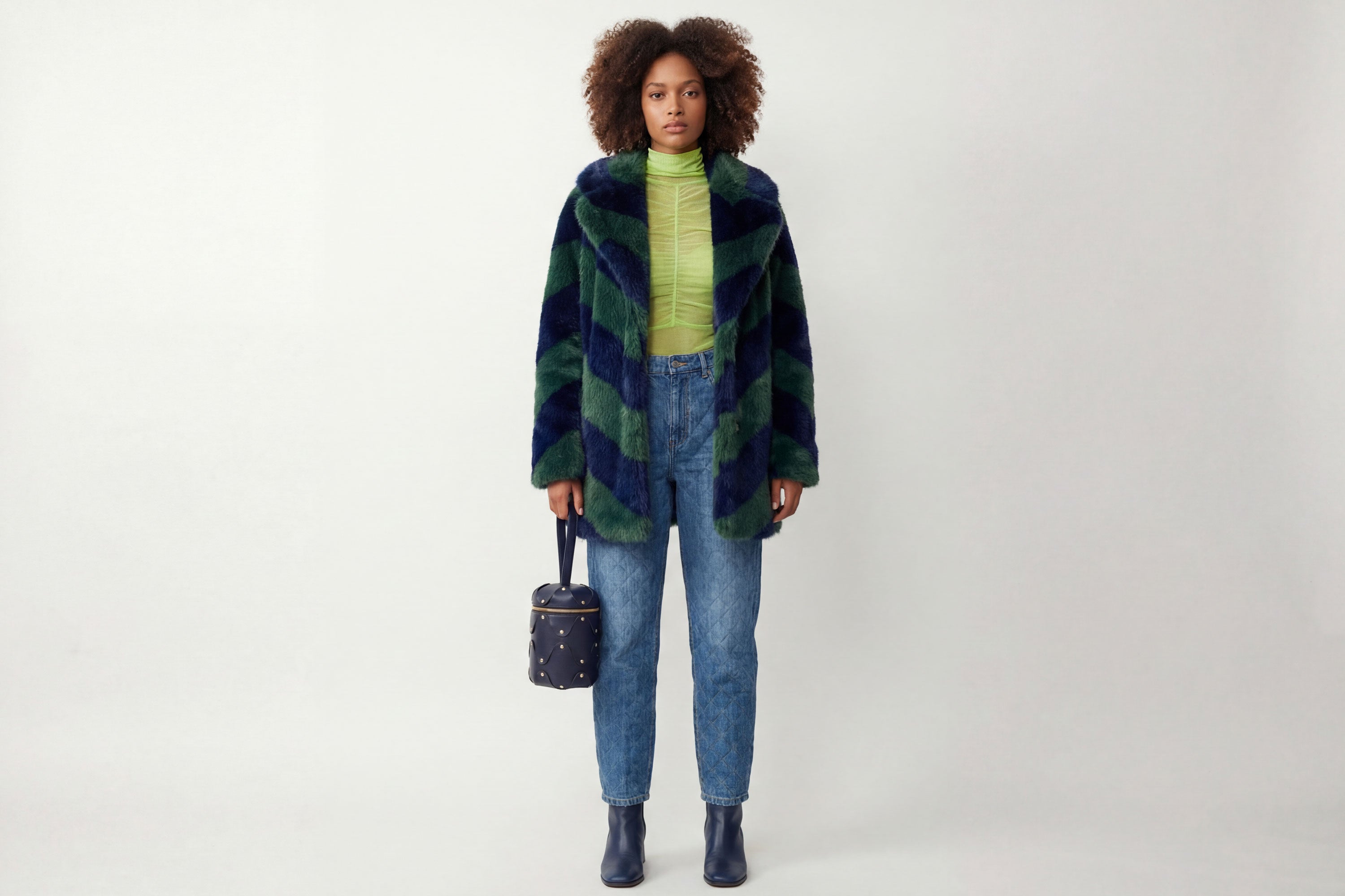 Nema Leather Bag Marine Blue Color On A Woman Model Vegetable Tanned Full Grain Spain Brass Rivets Premium Design Minimalist Modern Cylinder Circle Round Zipper Pouch Handbag  Atelier Madre Manuel Dreesmann Barcelona