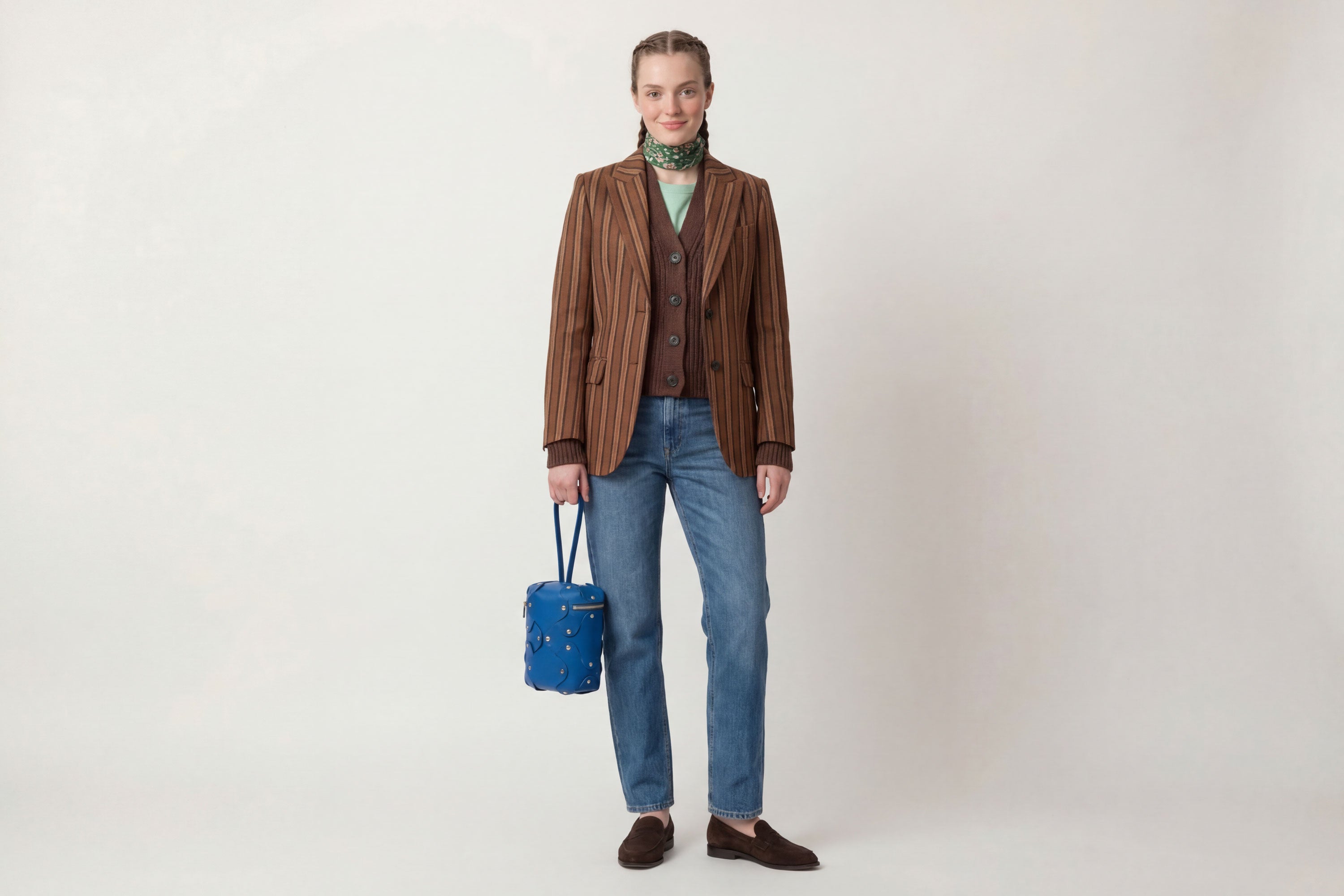 Nema Leather Bag Royal Blue Color On A Woman Model Vegetable Tanned Full Grain Spain Brass Rivets Premium Design Minimalist Modern Cylinder Circle Round Zipper Pouch Handbag  Atelier Madre Manuel Dreesmann Barcelona