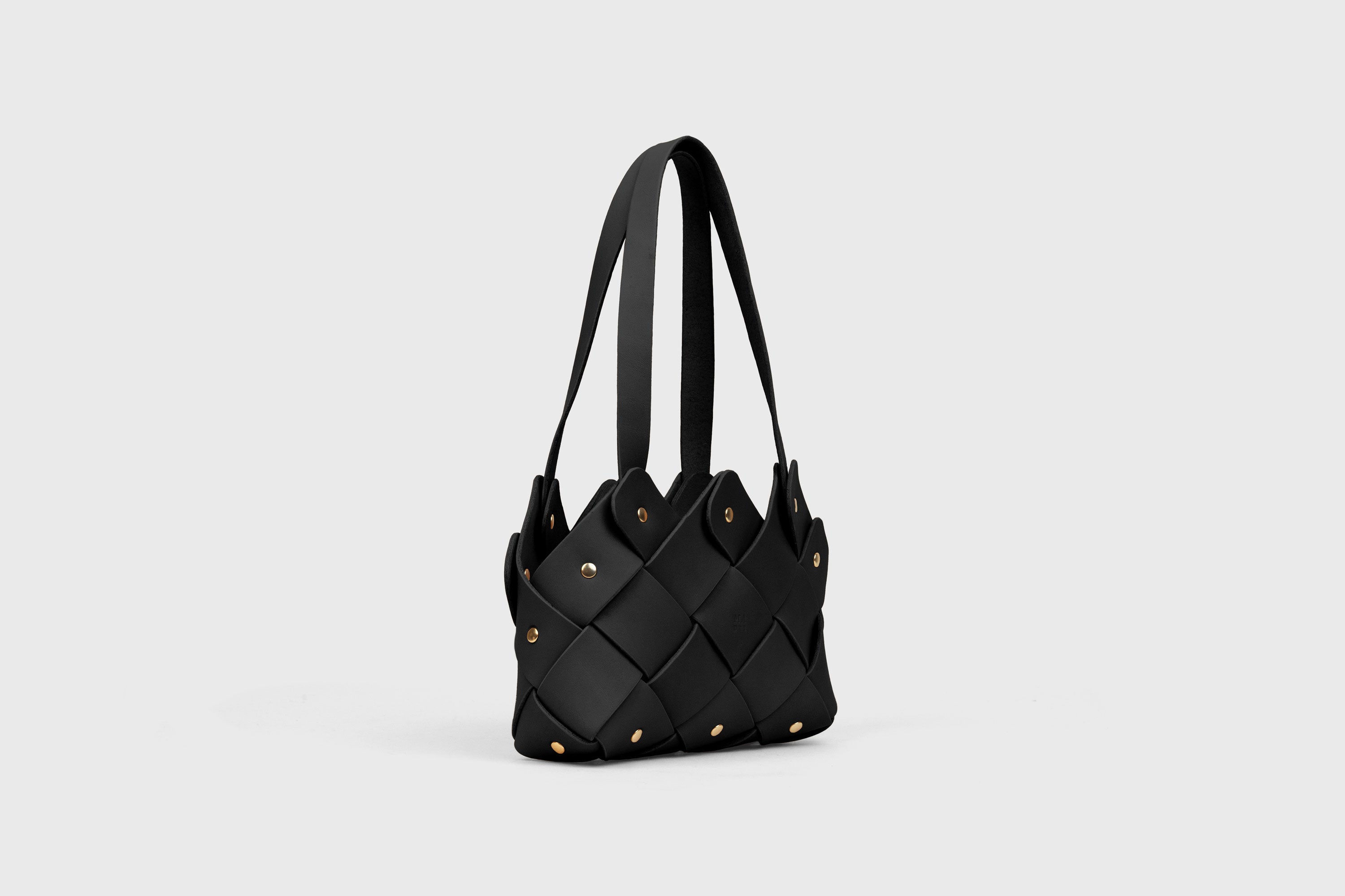 Pine Mini Tote Bag In Black Color In Vegetable Tanned Leather Woven Technique and Brass Rivets Atelier Madre Manuel Dreesmann Barcelona Spain