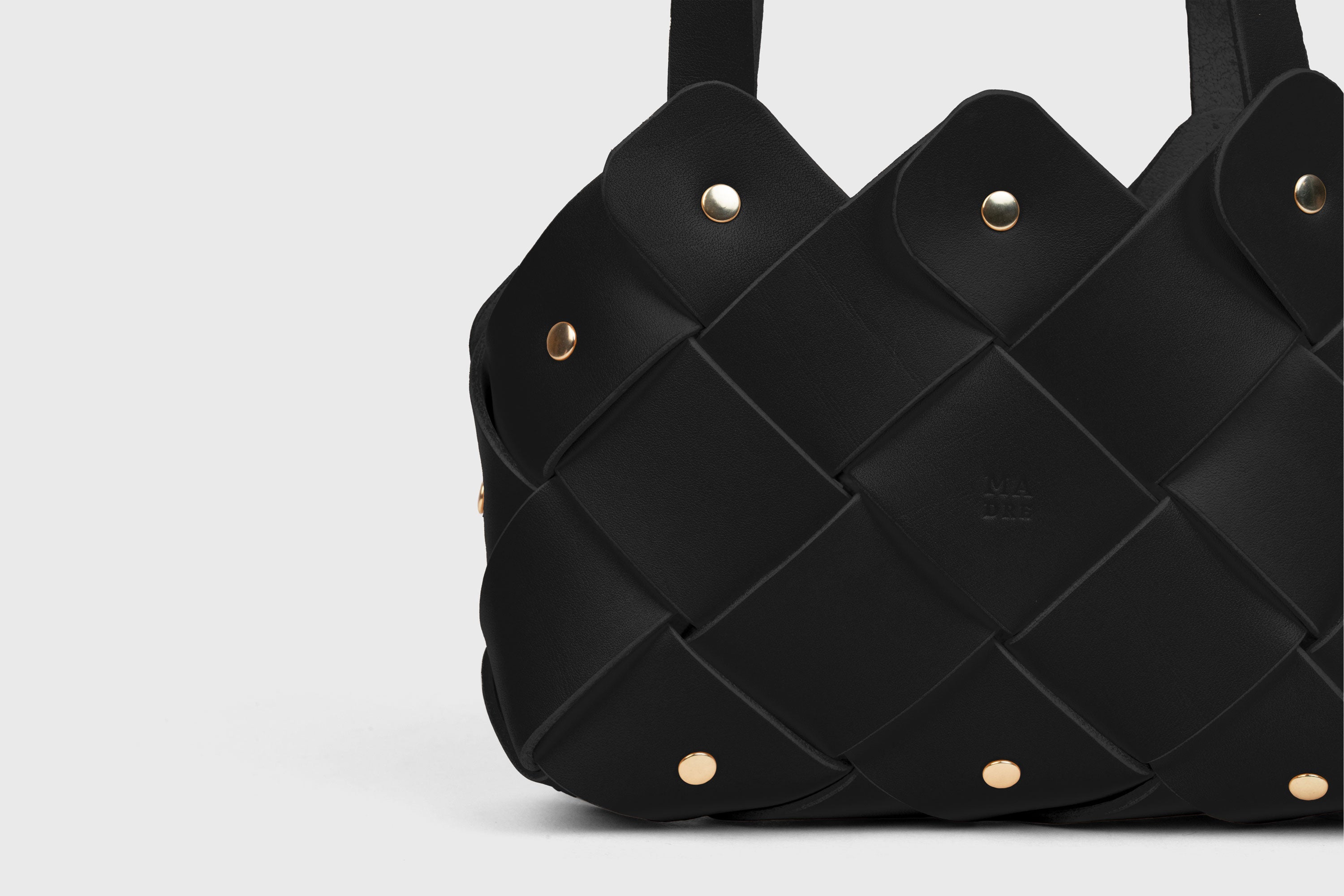 Pine Mini Tote Bag In Black Color In Vegetable Tanned Leather Woven Technique and Brass Rivets Atelier Madre Manuel Dreesmann Barcelona Spain