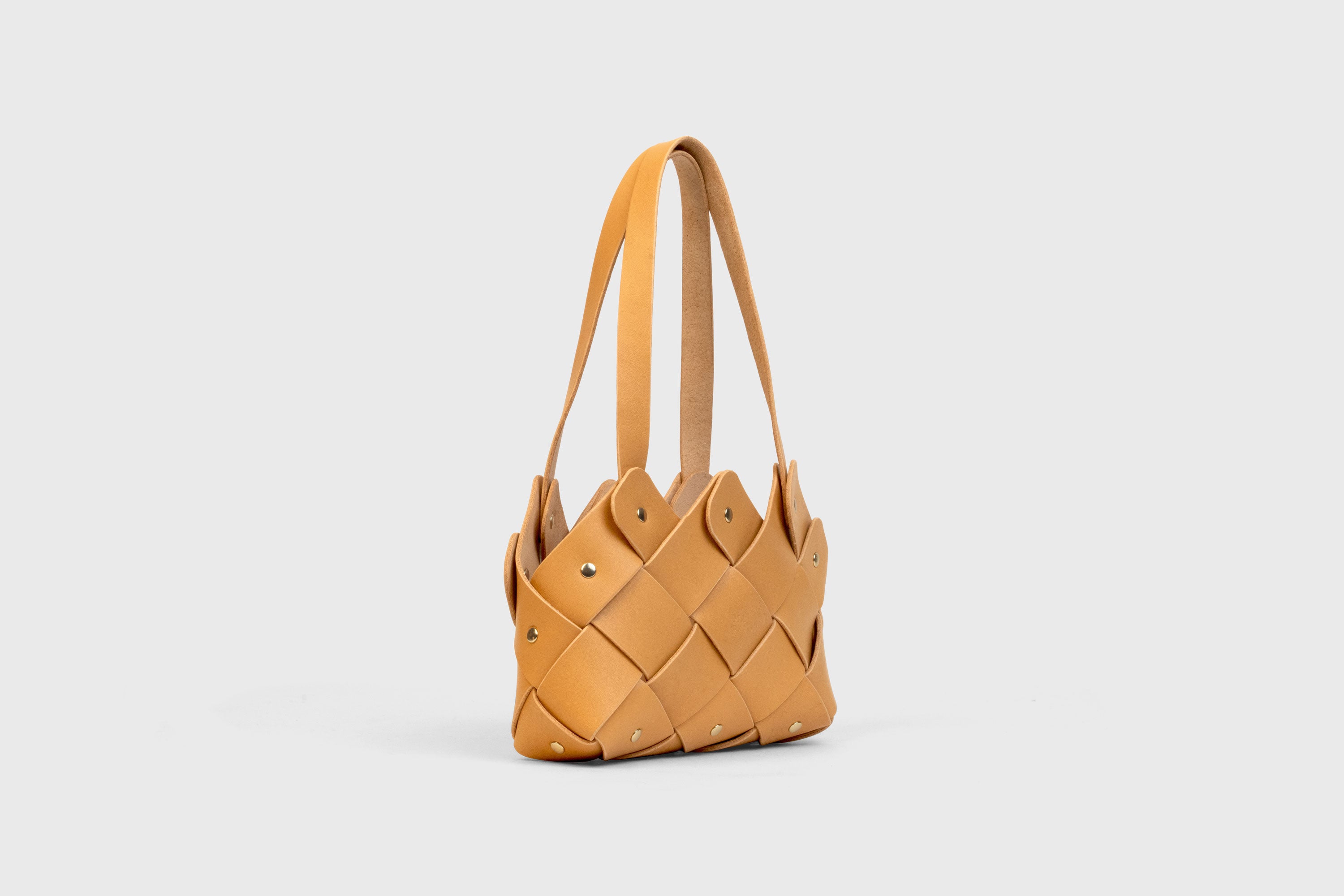 Pine Mini Tote Bag In Brown Color In Vegetable Tanned Leather Woven Technique and Brass Rivets Atelier Madre Manuel Dreesmann Barcelona Spain