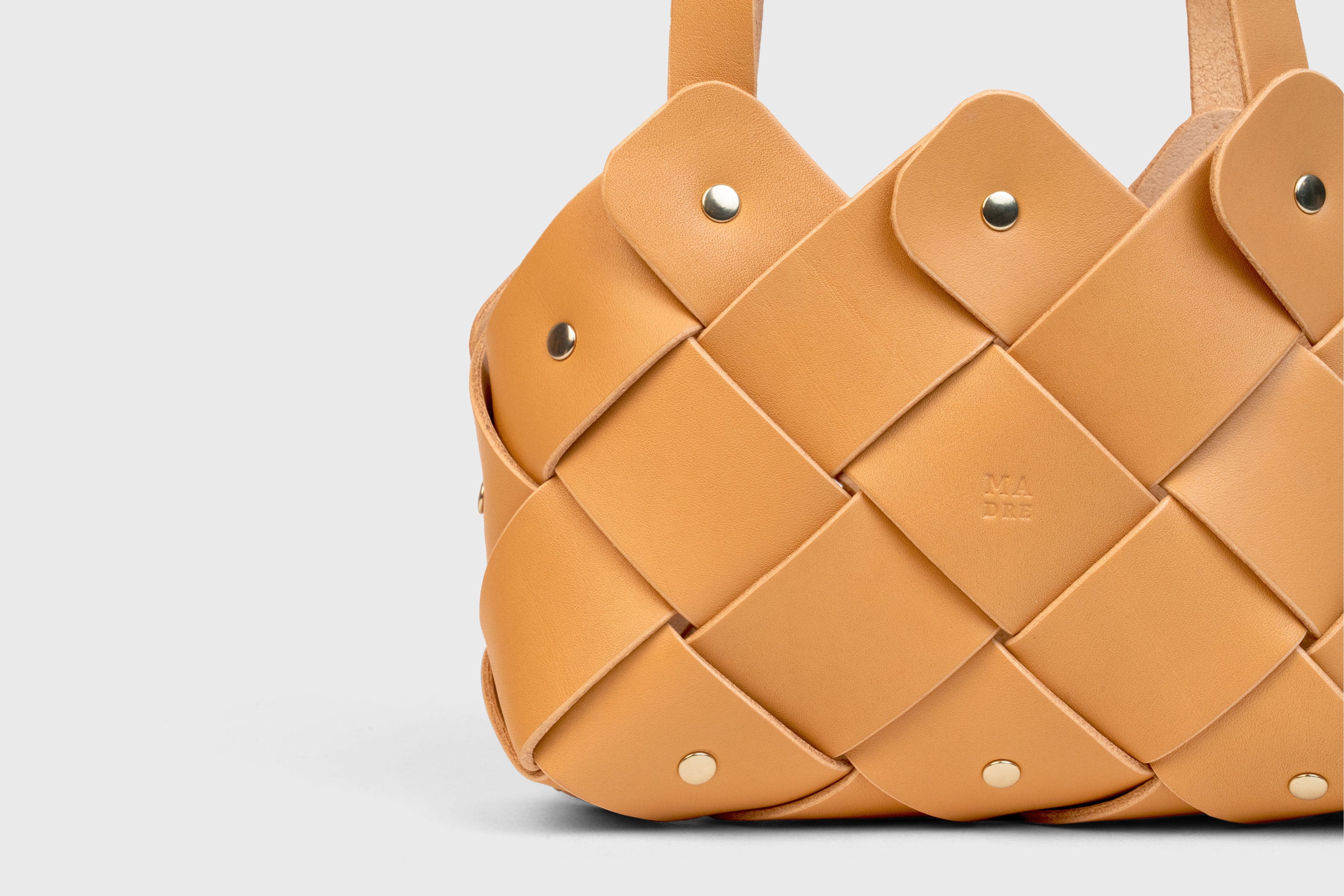 Pine Mini Tote Bag In Brown Color In Vegetable Tanned Leather Woven Technique and Brass Rivets Atelier Madre Manuel Dreesmann Barcelona Spain