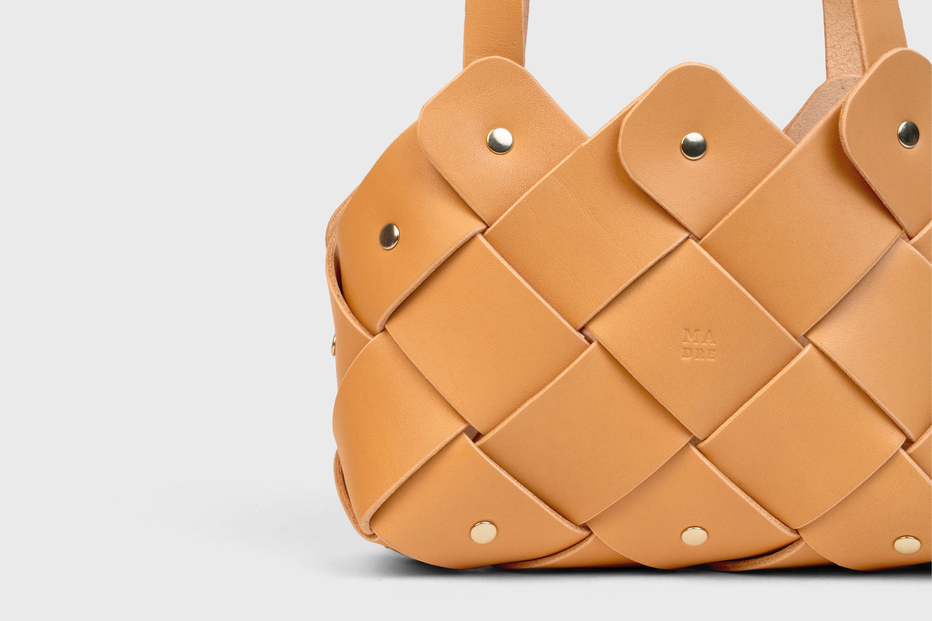 Pine Mini Tote Bag In Brown Color In Vegetable Tanned Leather Woven Technique and Brass Rivets Atelier Madre Manuel Dreesmann Barcelona Spain