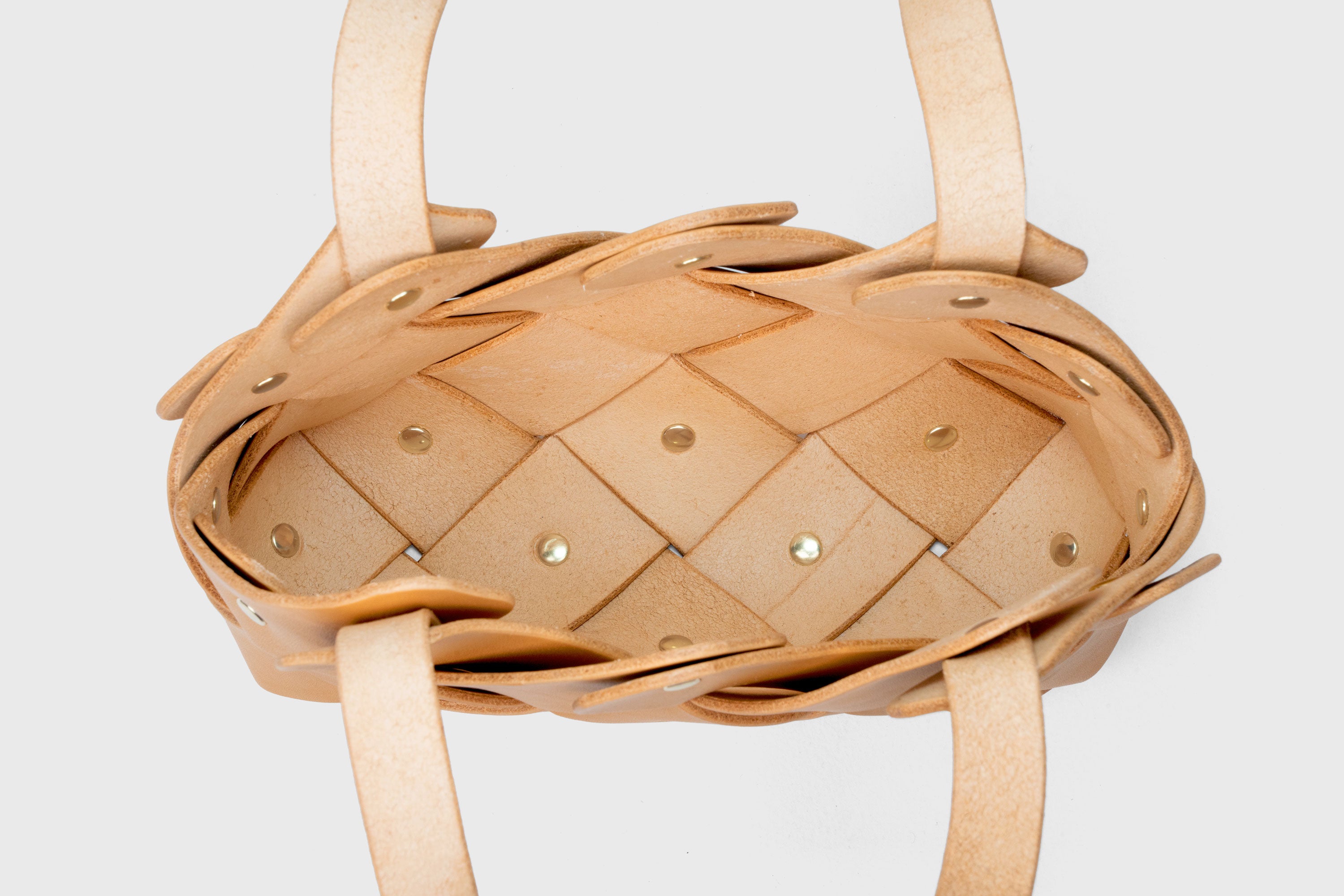 Pine Mini Tote Bag In Brown Color In Vegetable Tanned Leather Woven Technique and Brass Rivets Atelier Madre Manuel Dreesmann Barcelona Spain