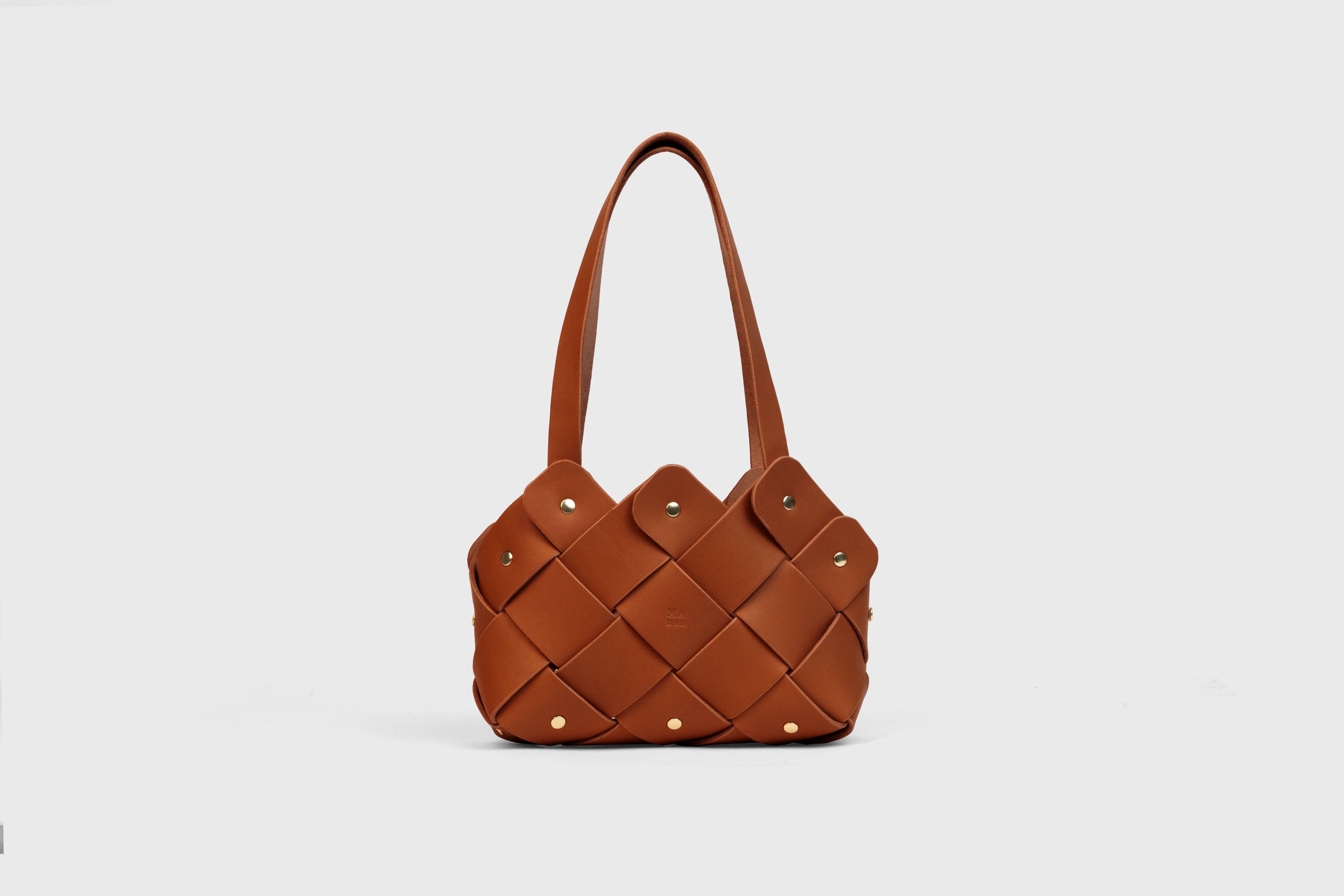 Pine Mini Tote Bag In Dark Brown Color In Vegetable Tanned Leather Woven Technique and Brass Rivets Atelier Madre Manuel Dreesmann Barcelona Spain