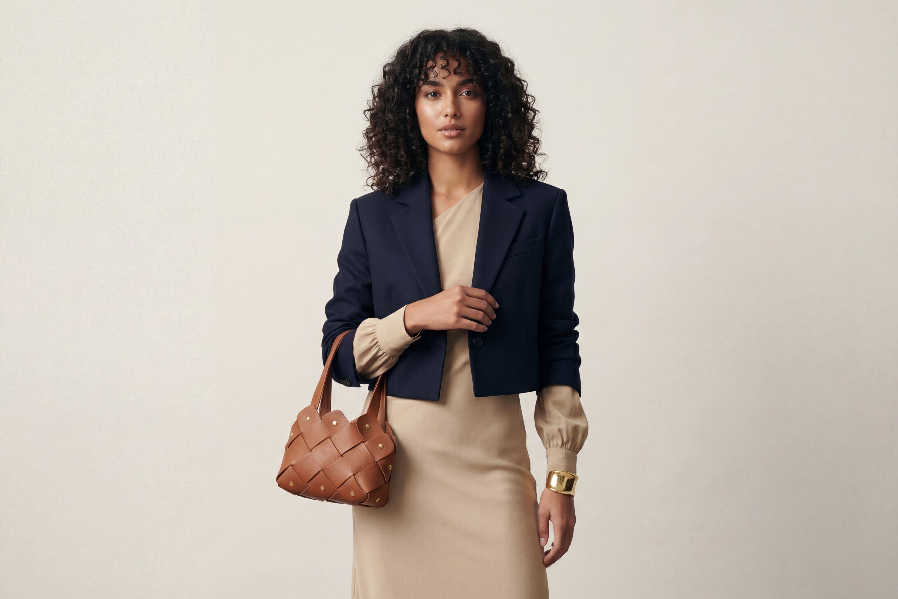 Pine Mini Tote Bag In Dark Brown Color In Vegetable Tanned Leather On Woman Model Woven Technique and Brass Rivets Atelier Madre Manuel Dreesmann Barcelona Spain