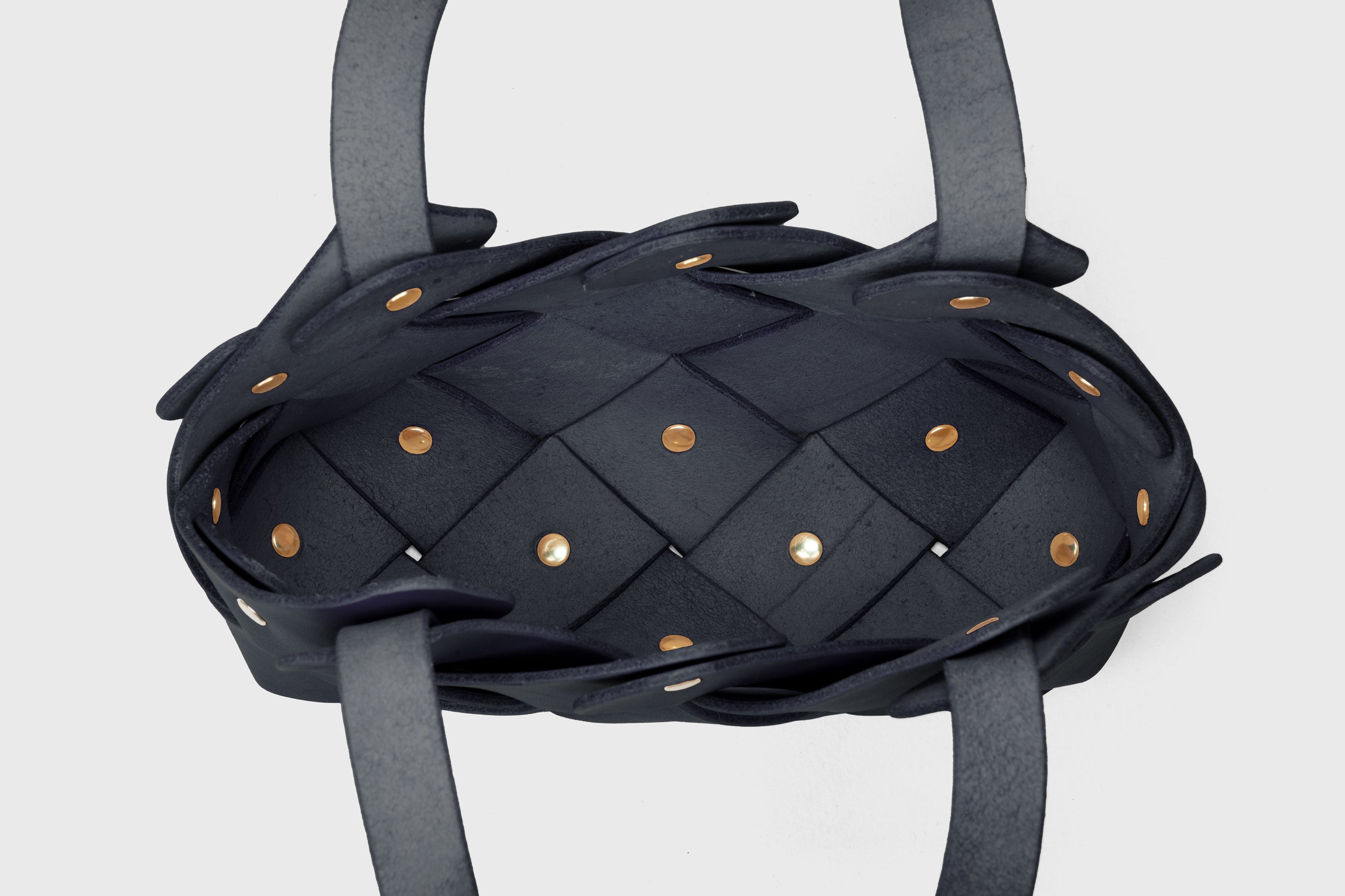 Pine Mini Tote Bag In Marine Blue Color In Vegetable Tanned Leather Woven Technique and Brass Rivets Atelier Madre Manuel Dreesmann Barcelona Spain