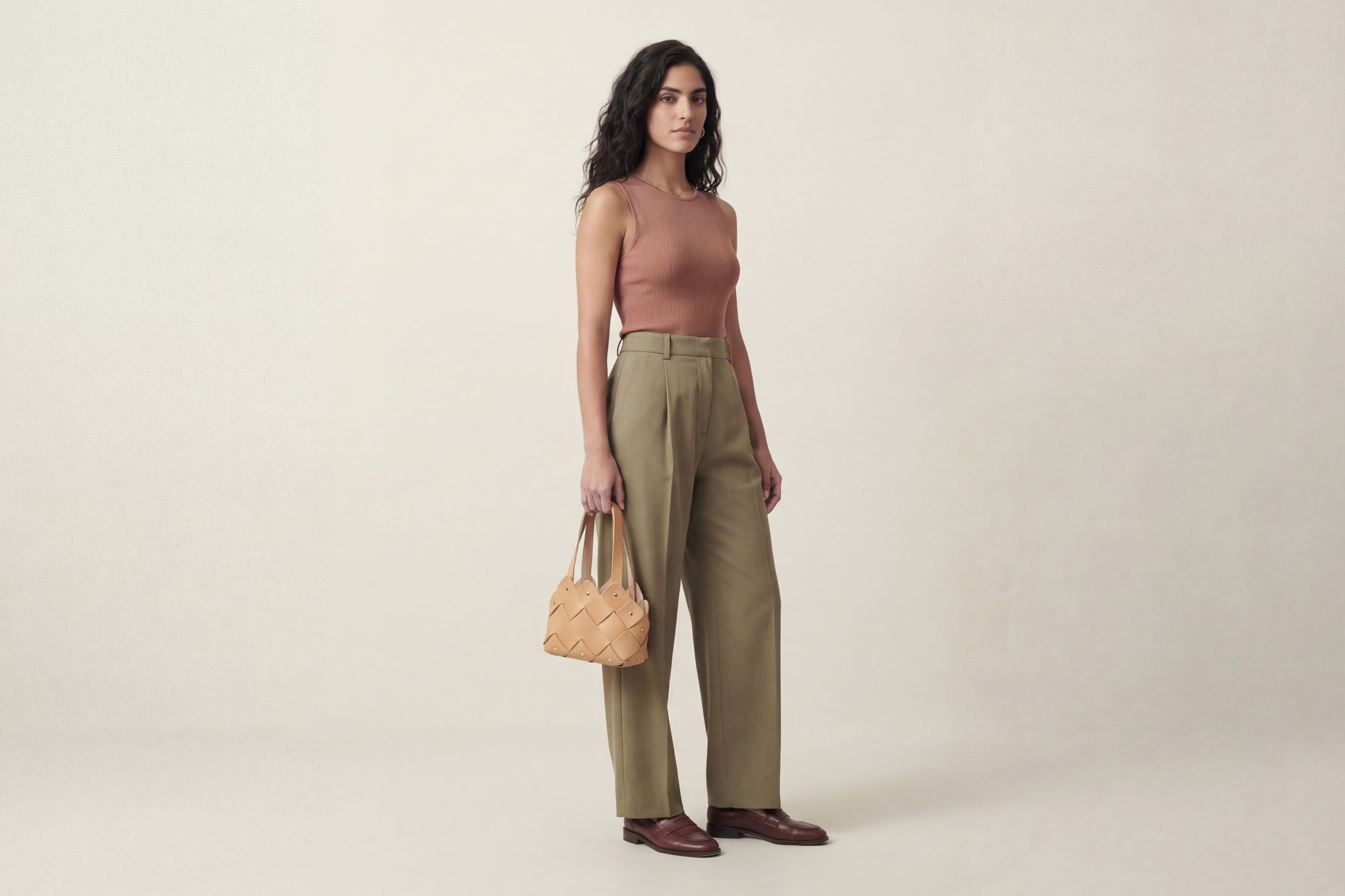 Pine Mini Tote Bag In Natural Color In Vegetable Tanned Leather On Woman Model Woven Technique and Brass Rivets Atelier Madre Manuel Dreesmann Barcelona Spain