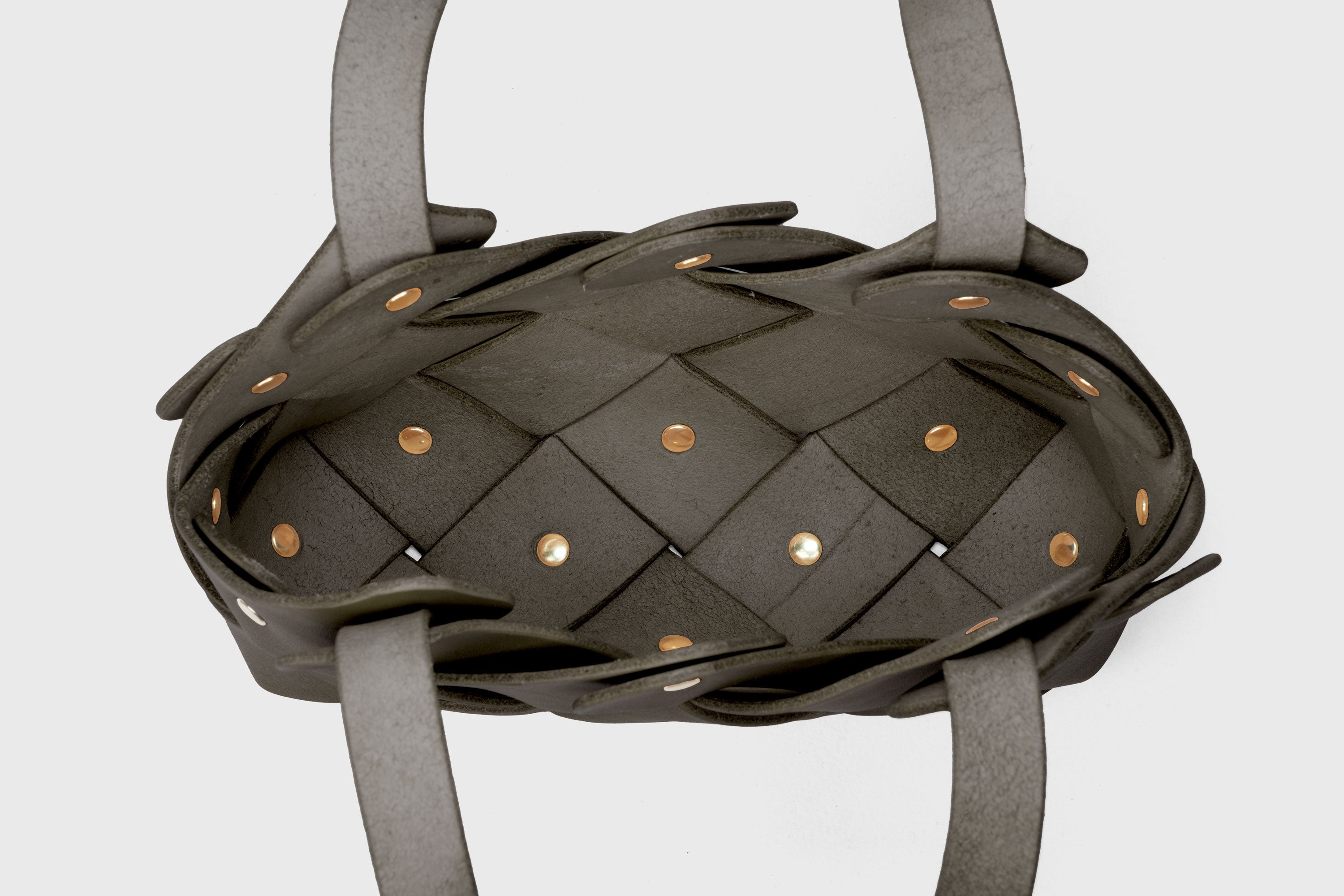 Pine Mini Tote Bag In Olive Green Color In Vegetable Tanned Leather Woven Technique and Brass Rivets Atelier Madre Manuel Dreesmann Barcelona Spain