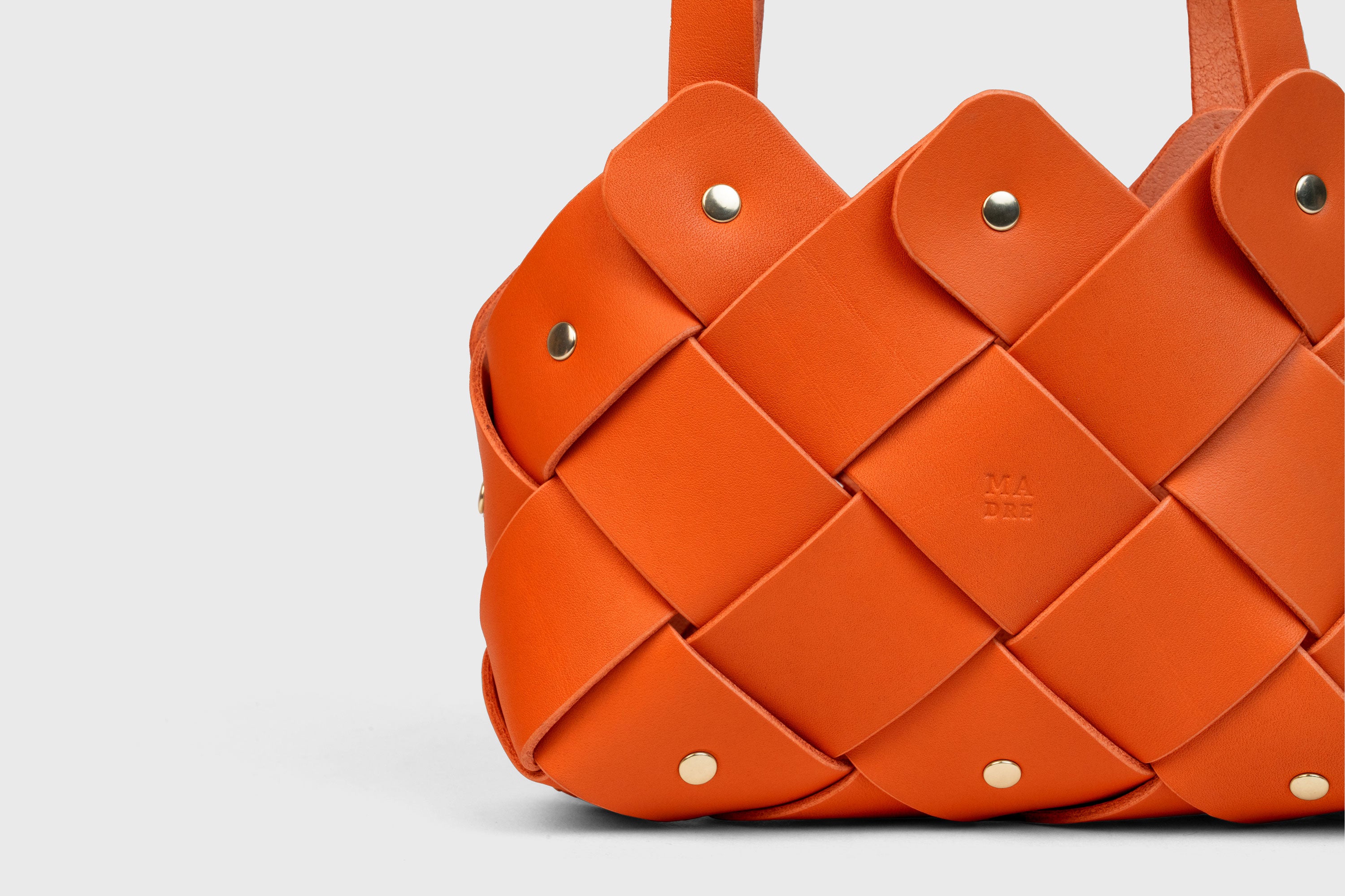 Pine Mini Tote Bag In Orange Color In Vegetable Tanned Leather Woven Technique and Brass Rivets Atelier Madre Manuel Dreesmann Barcelona Spain